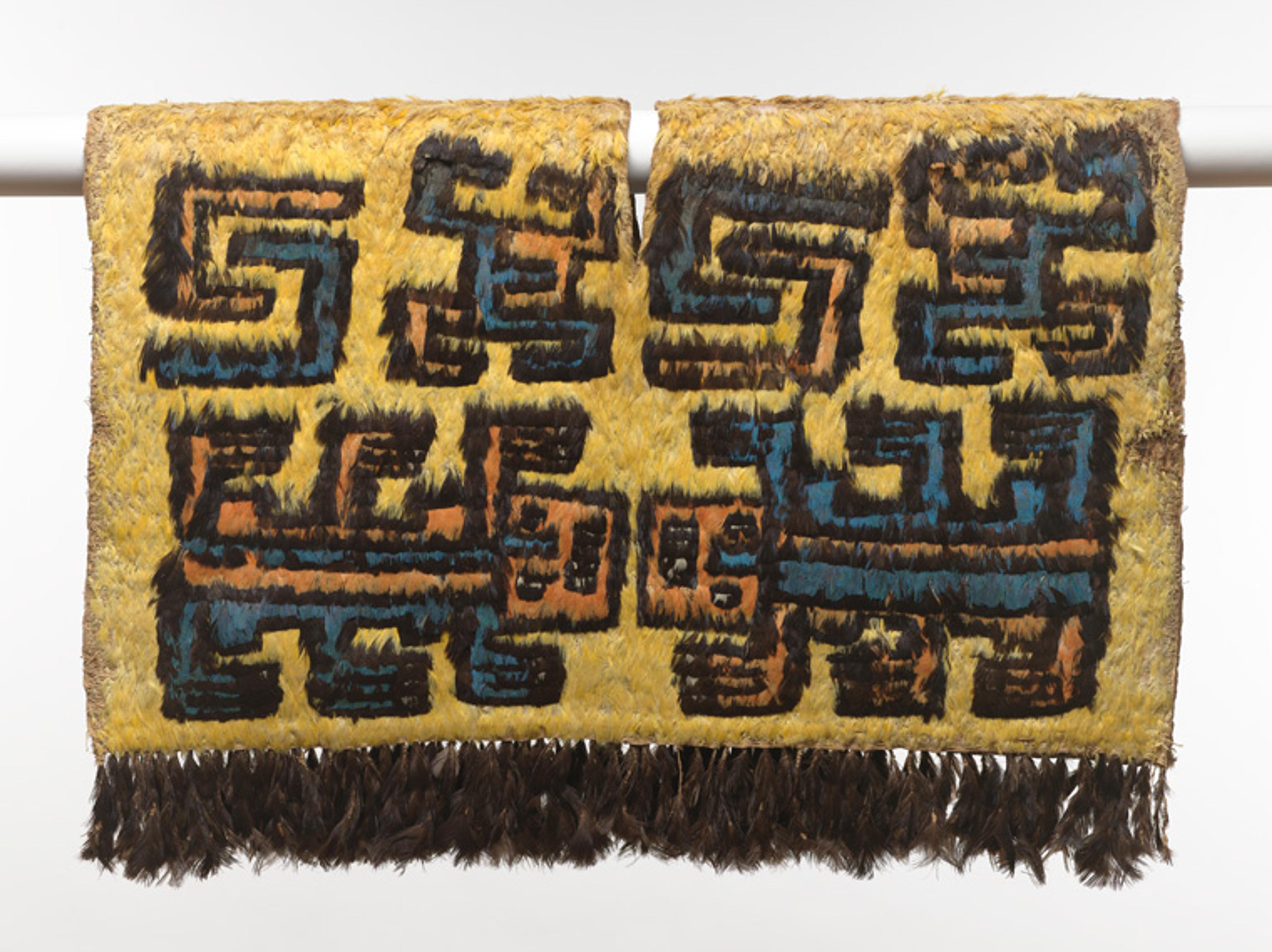 Peruvian textile with an intricate design of lizard-like creatures