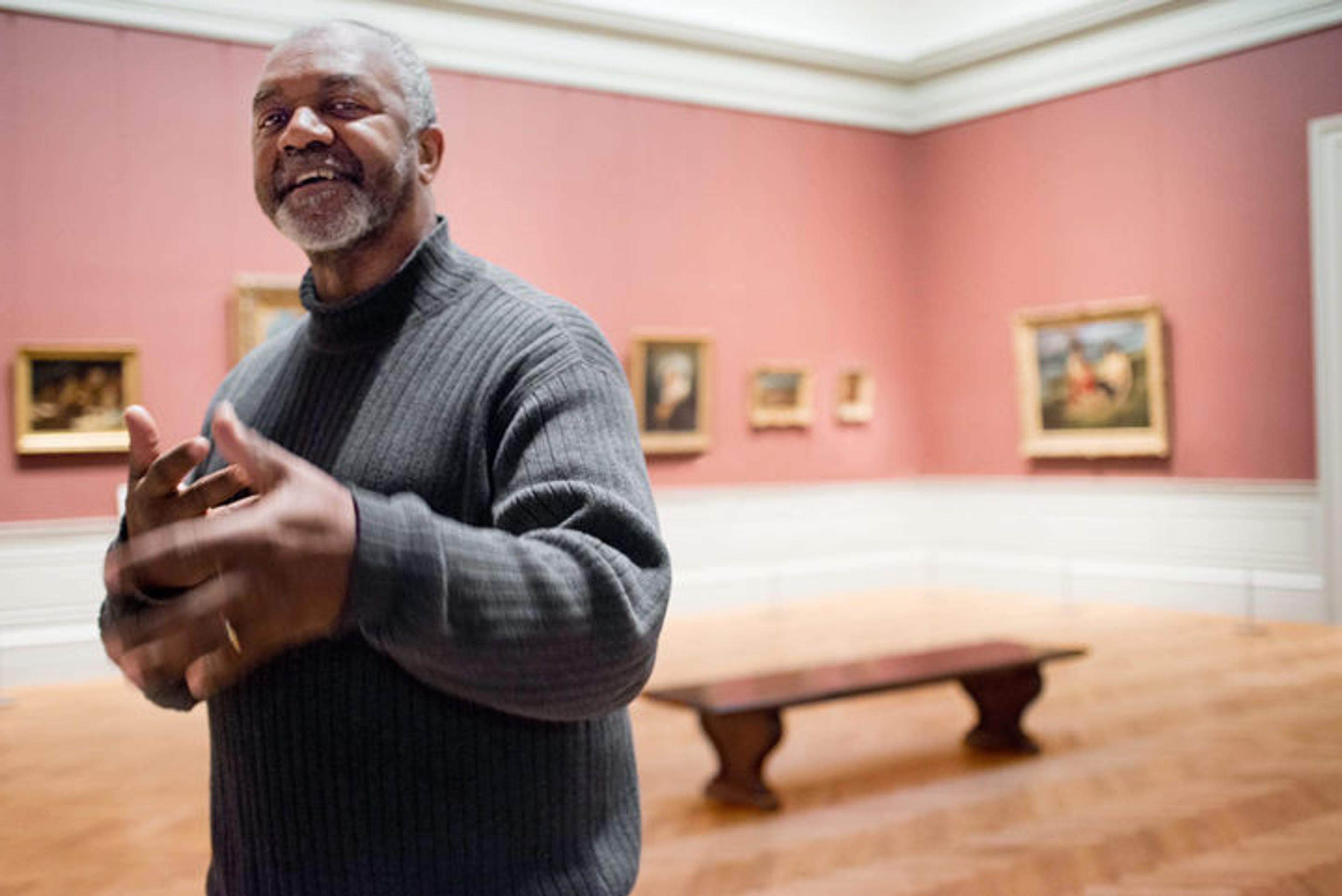 Photo of artist Kerry James Marshall in a gallery of European painting