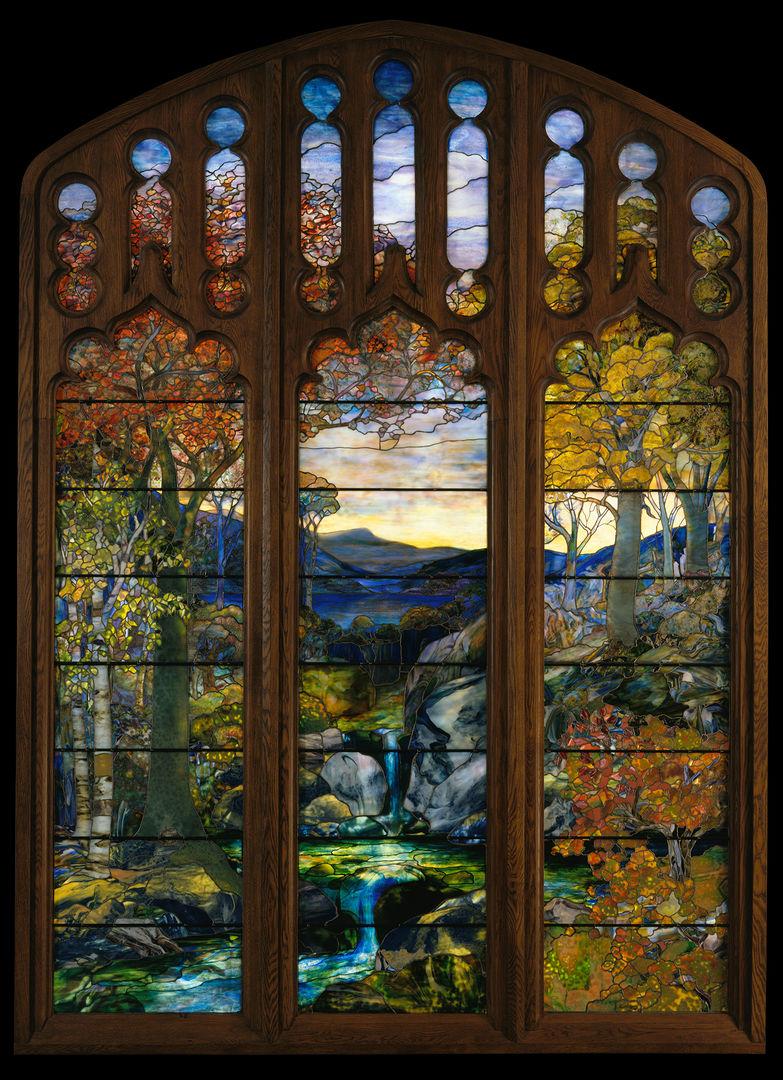 Autumn landscape featuring a river, mountains and trees made of stained glass