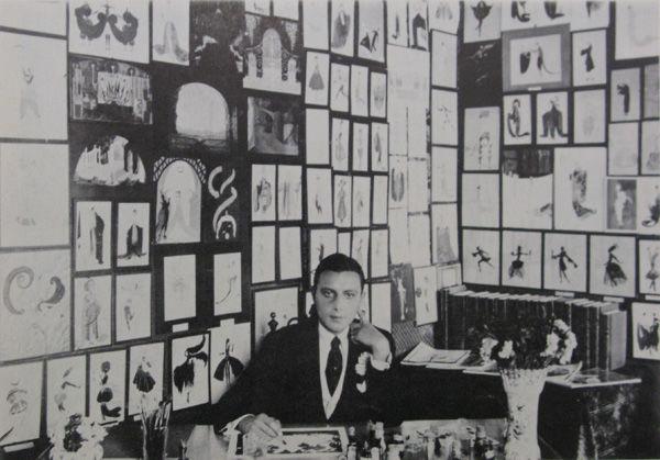 Fig. 5. Erté in his studio in Monte Carlo, the walls of which were covered in his drawings, 1917. Reproduction of a black and white photograph used in the pamphlet for his exhibition at the Grosvenor Gallery, New York, held June 7–July 1, 1967