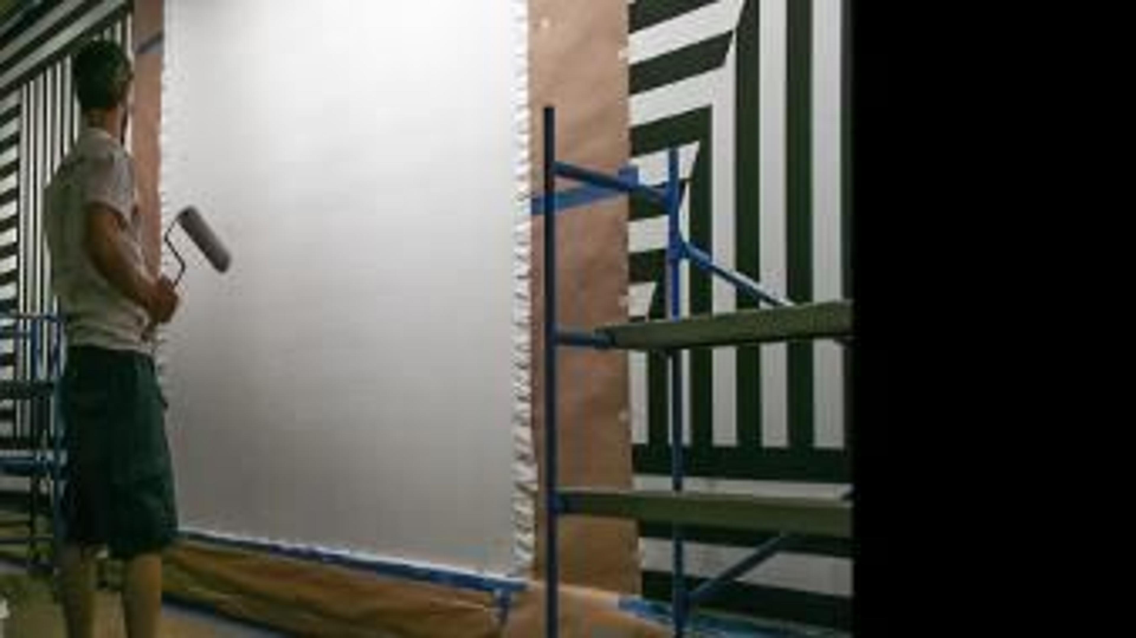 People installing Sol LeWitt's work in the gallery