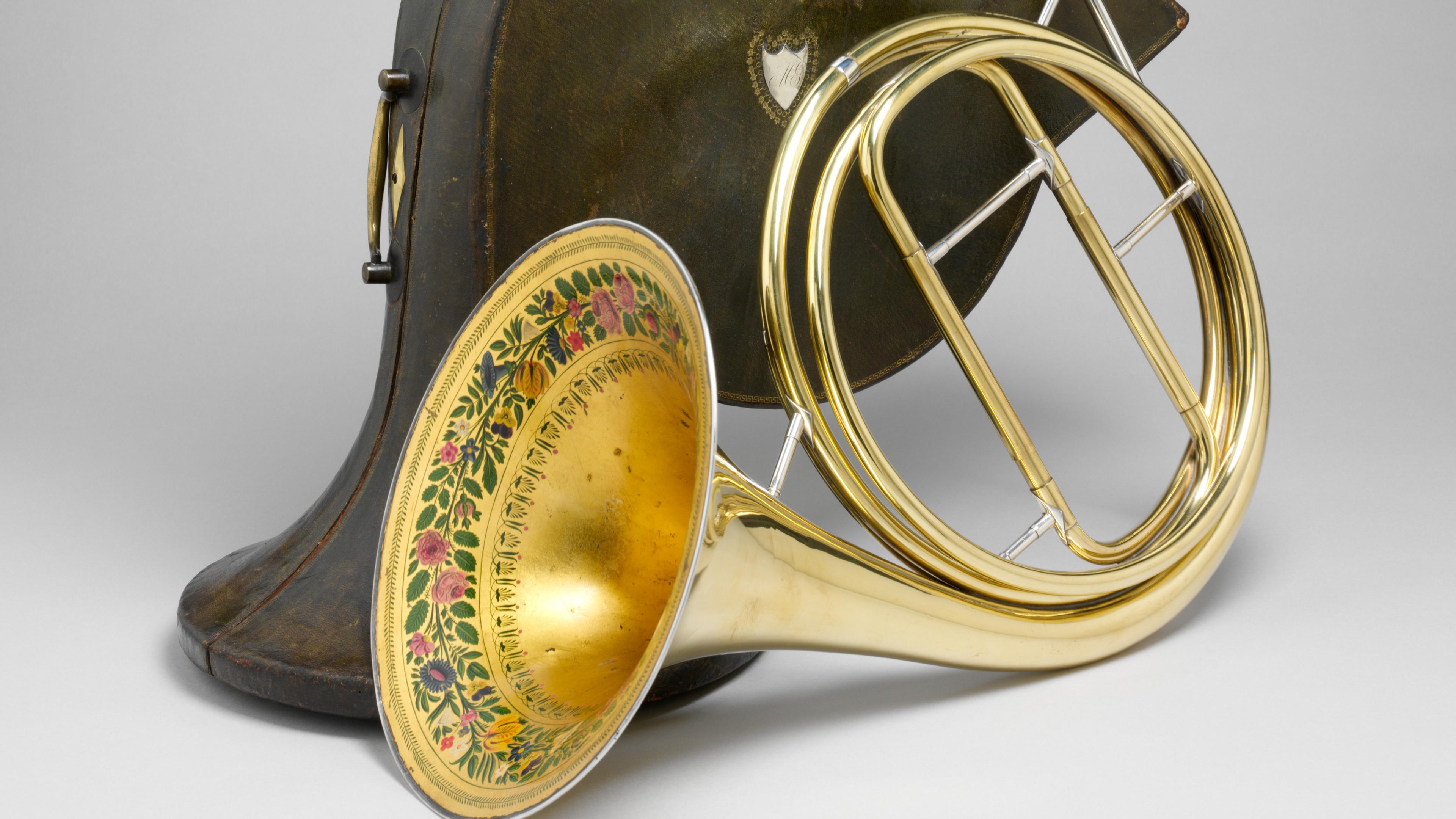 Horn and case, with an interior bell decorated with a floral motif