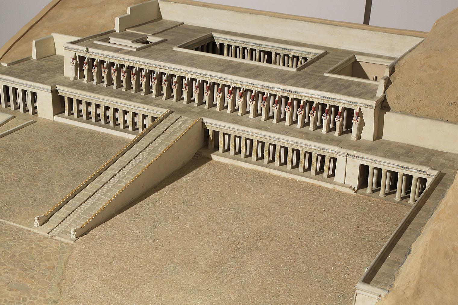 View of terraced temple from above right. A ramp leads from the ground to the second level.