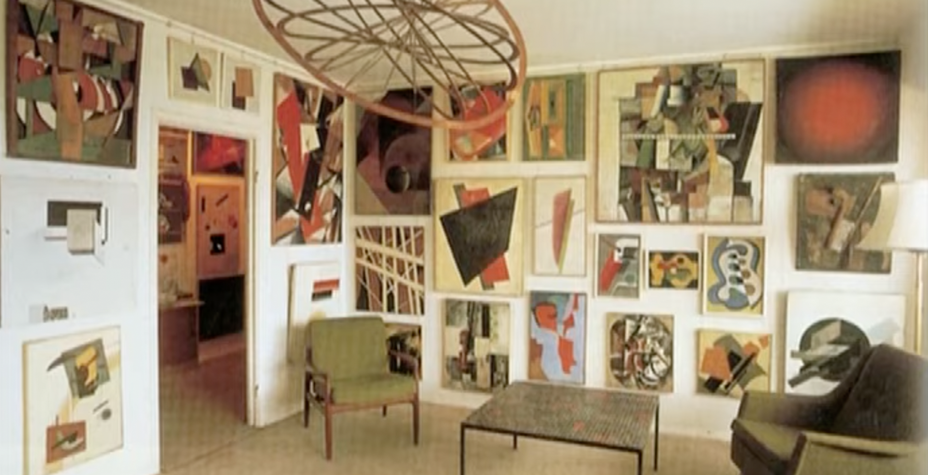 White room with the walls decorated in Cubist paintings belonging to George Costakis