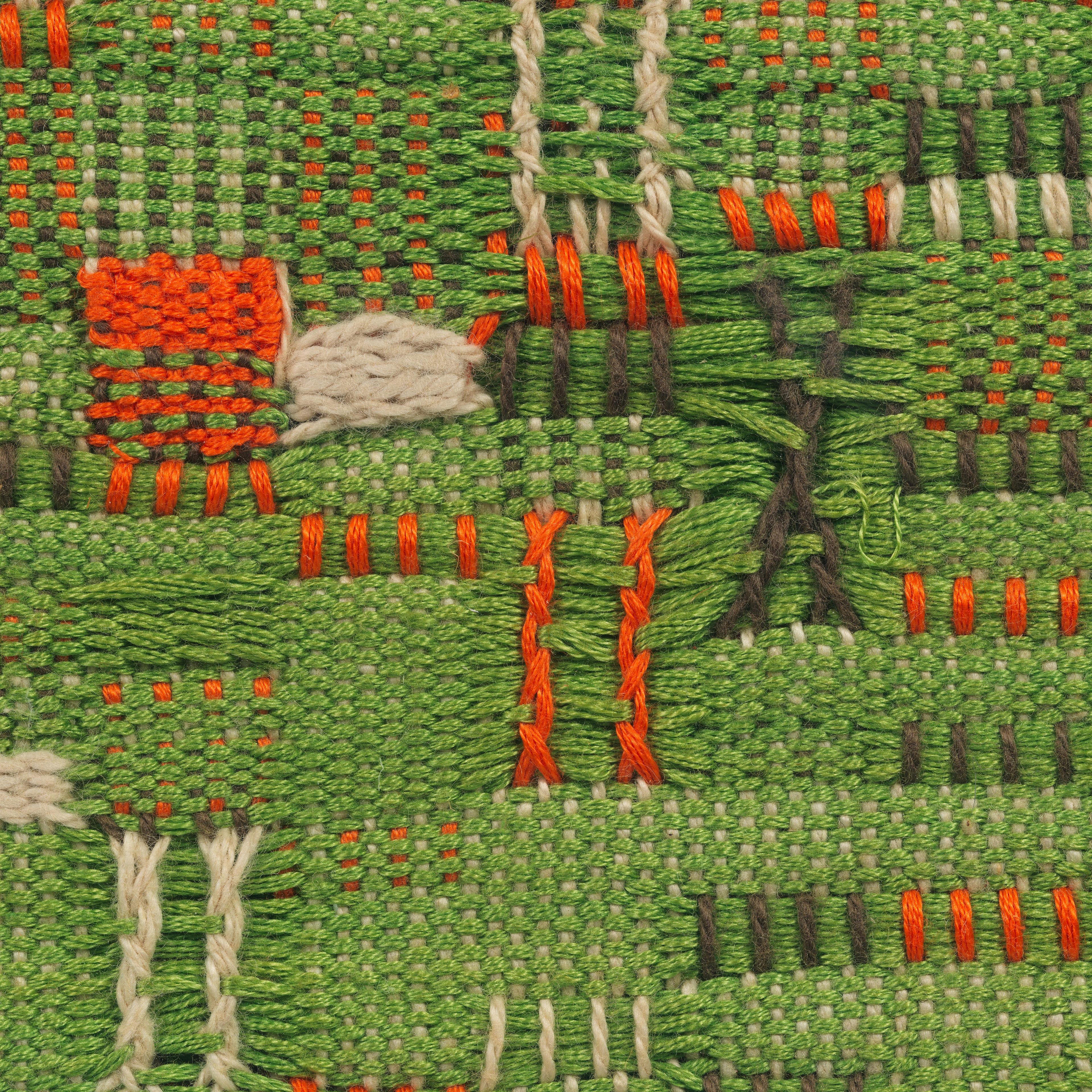Weaving of mixed colors: green, orange, black, and white.