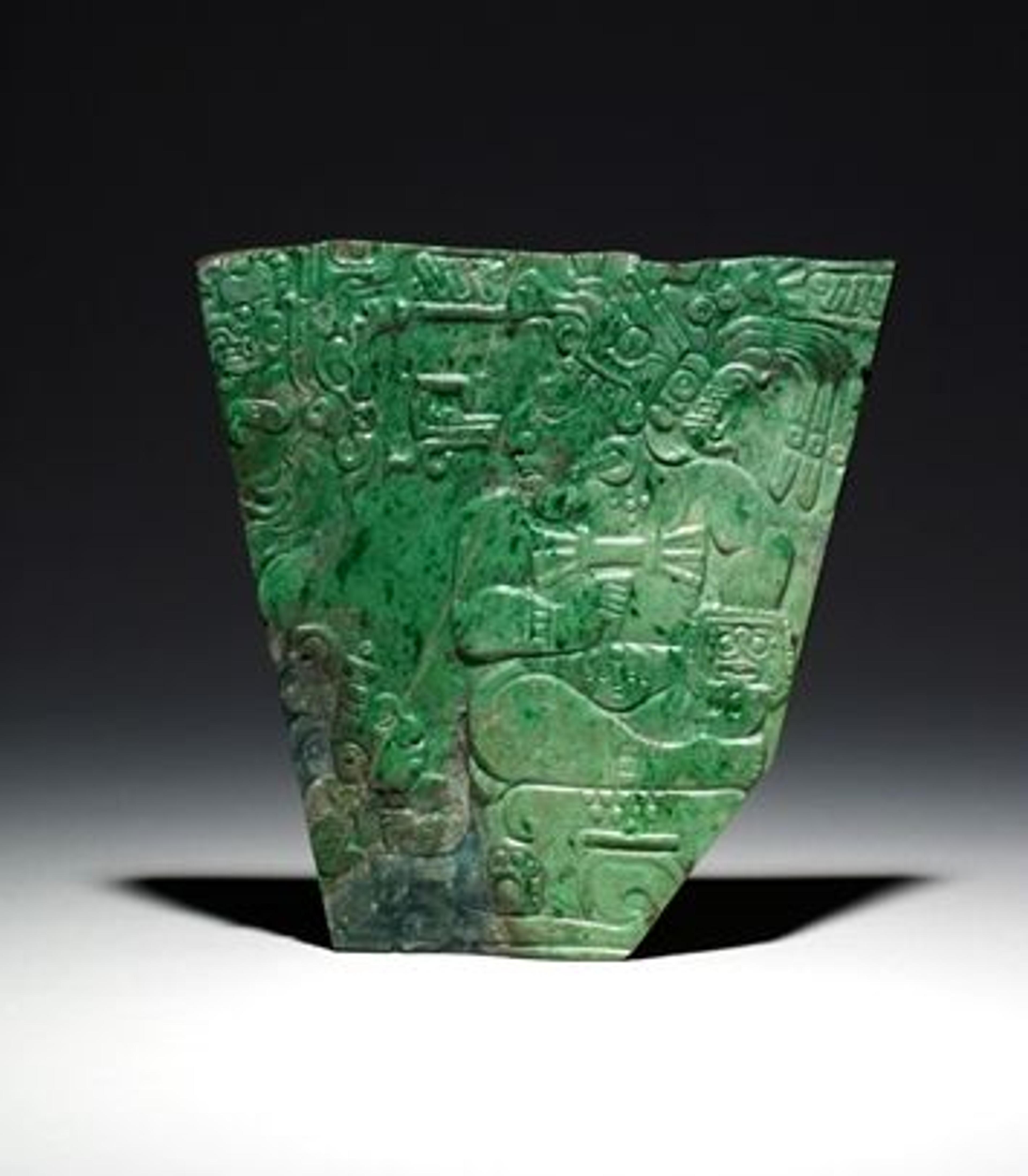 A jade plaque showing a seated king and palace attendant, made by a Maya artist sometime between A.D. 600 and 800