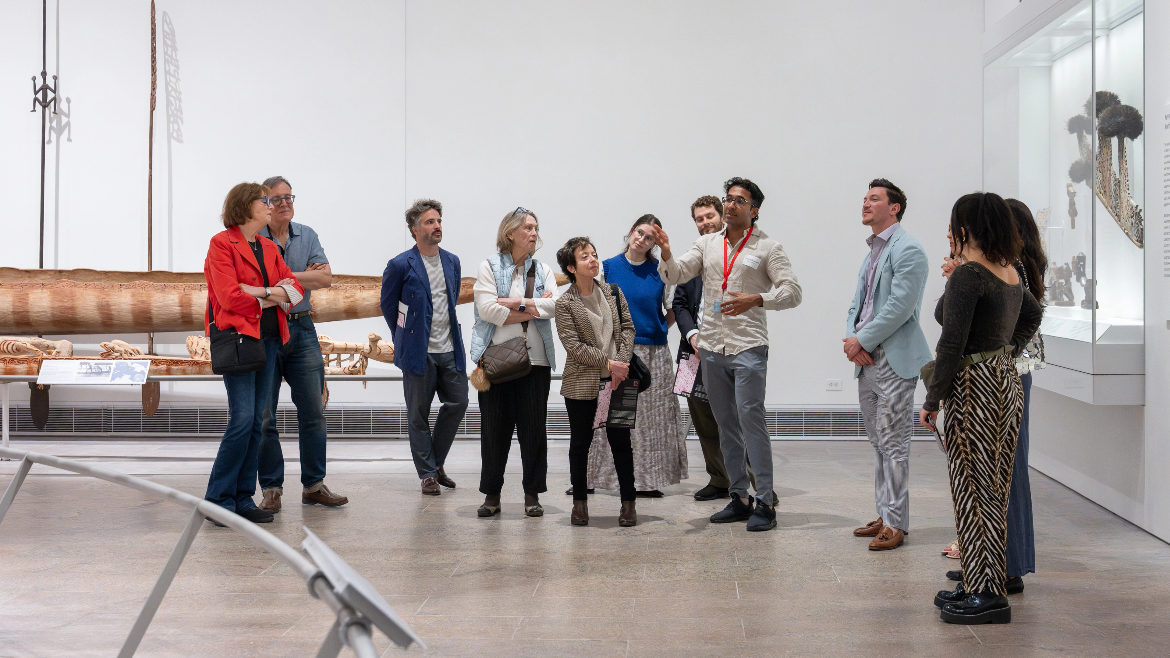 A group of people on a Museum wide tour. 