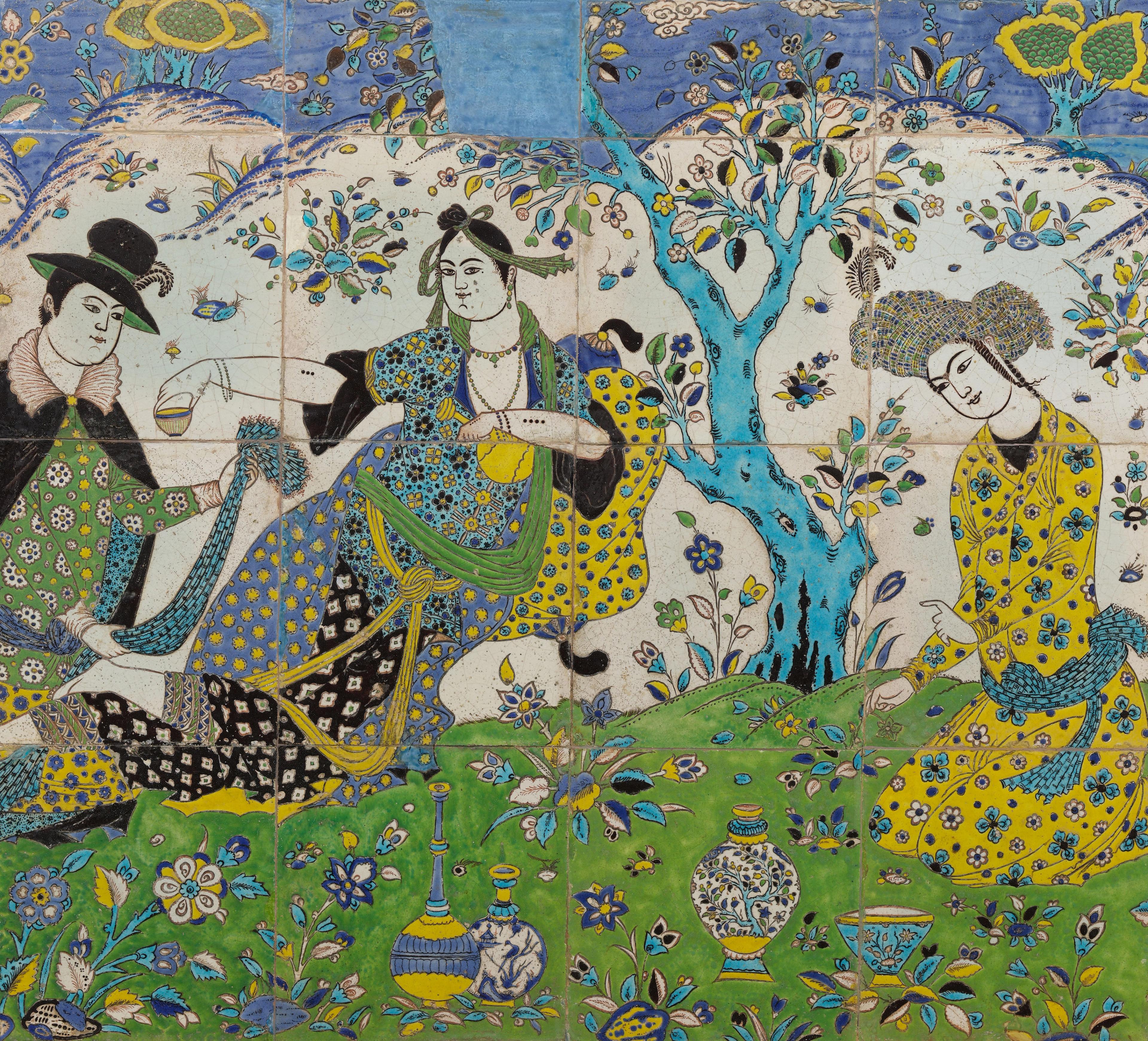 An Iranian tile panel in greens, blues, and yellows depicting three figures seated on the grass.