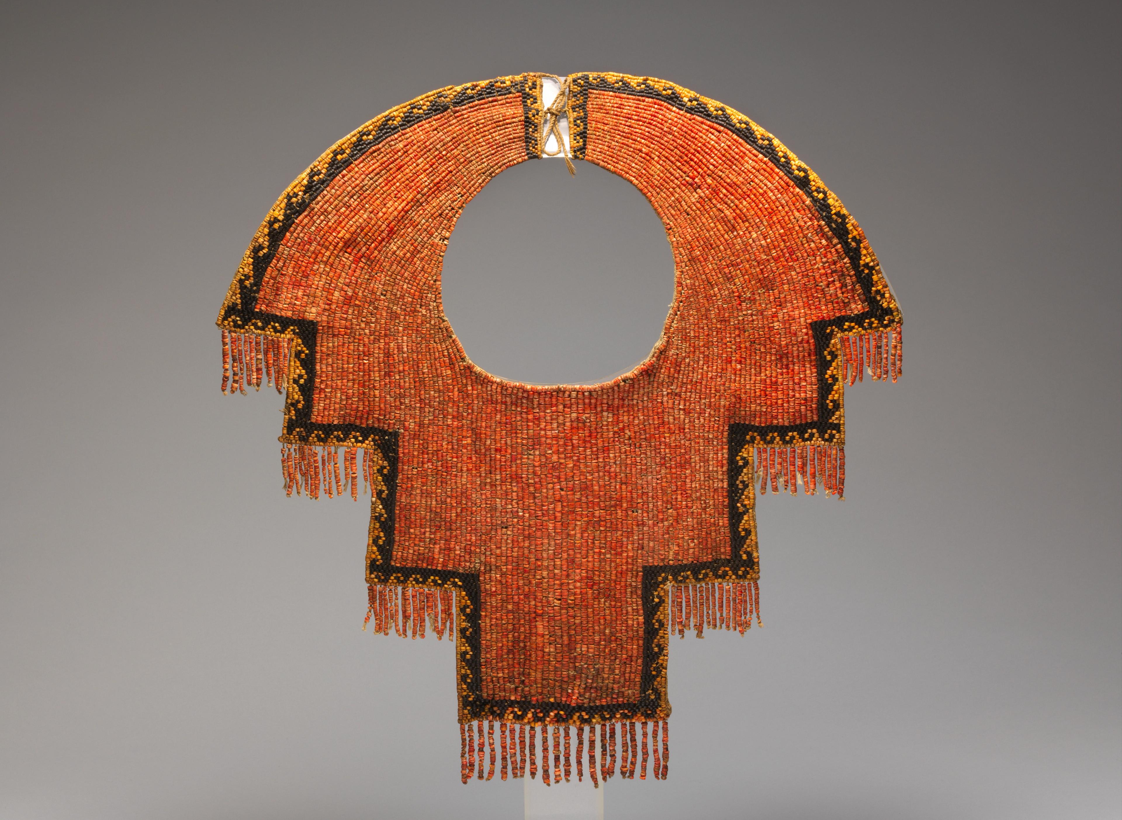 Elaborate, geometric beaded collar made of red shells