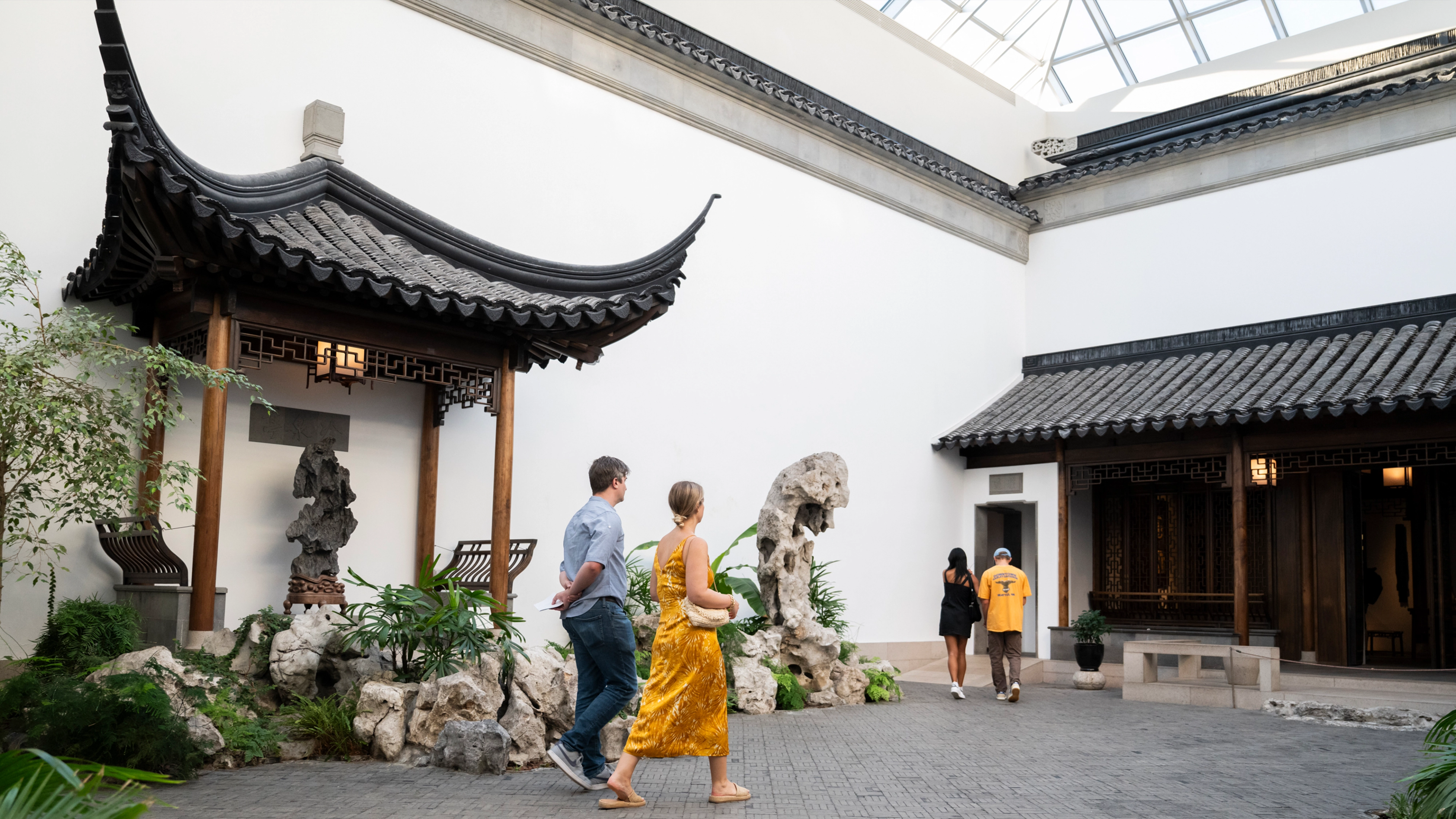 People explore The Astor Chinese Garden Court at The Met.