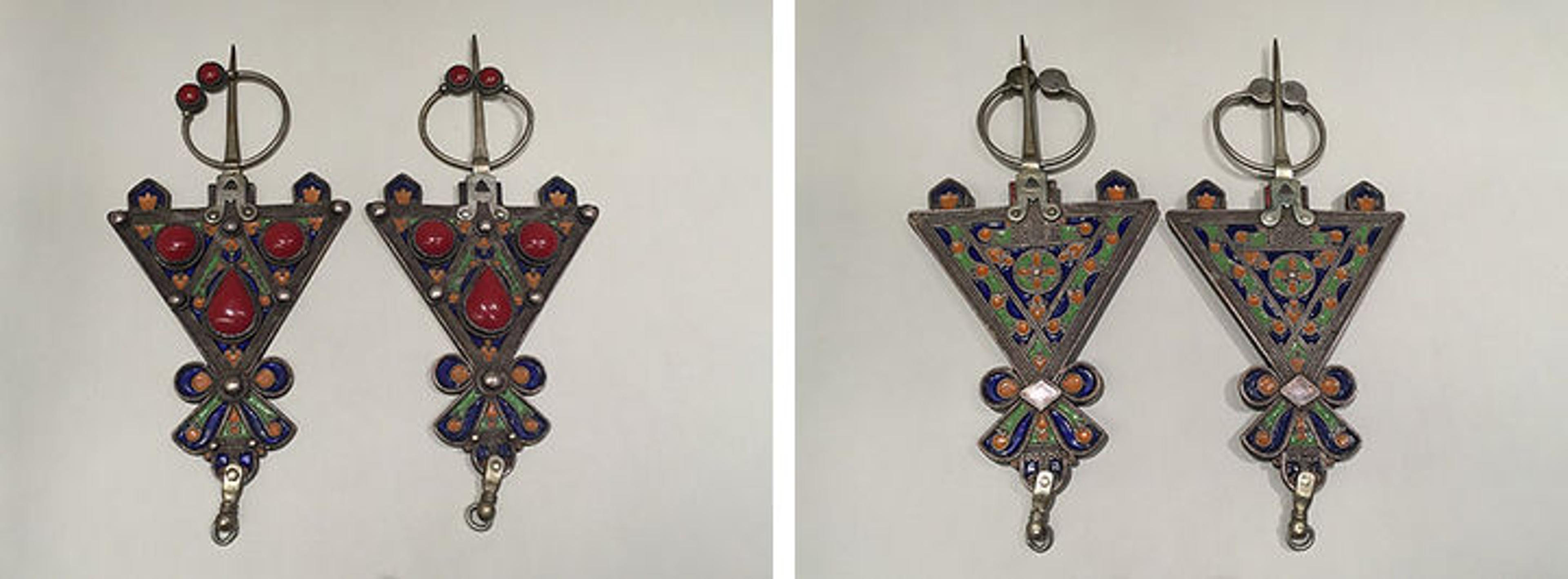 Left: Silver fibulae inset with imitation coral. Right: The back of the same fibulae