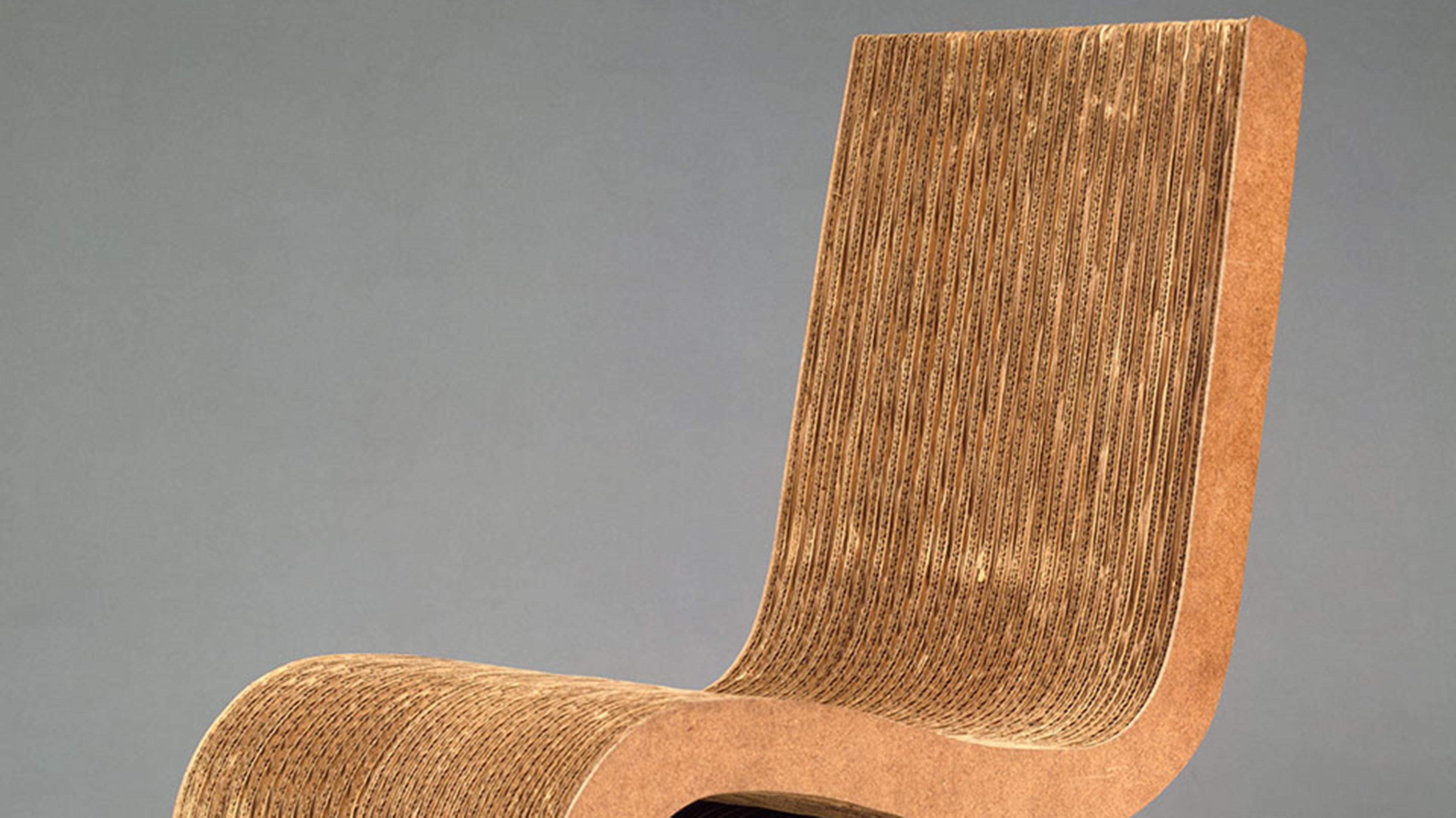 Sculptural chair made from a series of layered curves, made of exposed layered cardboard.