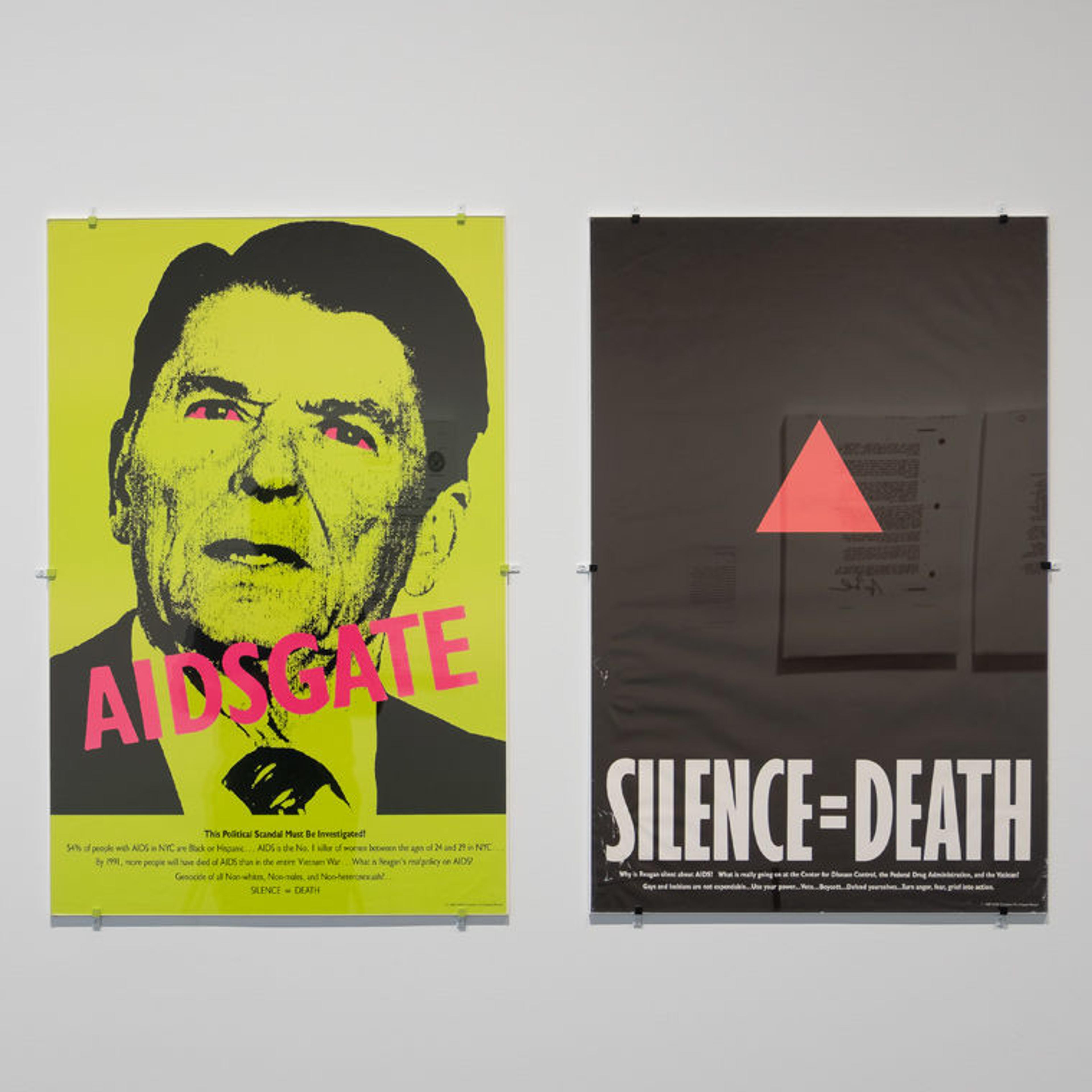 View of an gallery wall at The Met Breuer displaying two protest posters by the Silence = Death Project created during the early days of the AIDS epidemic