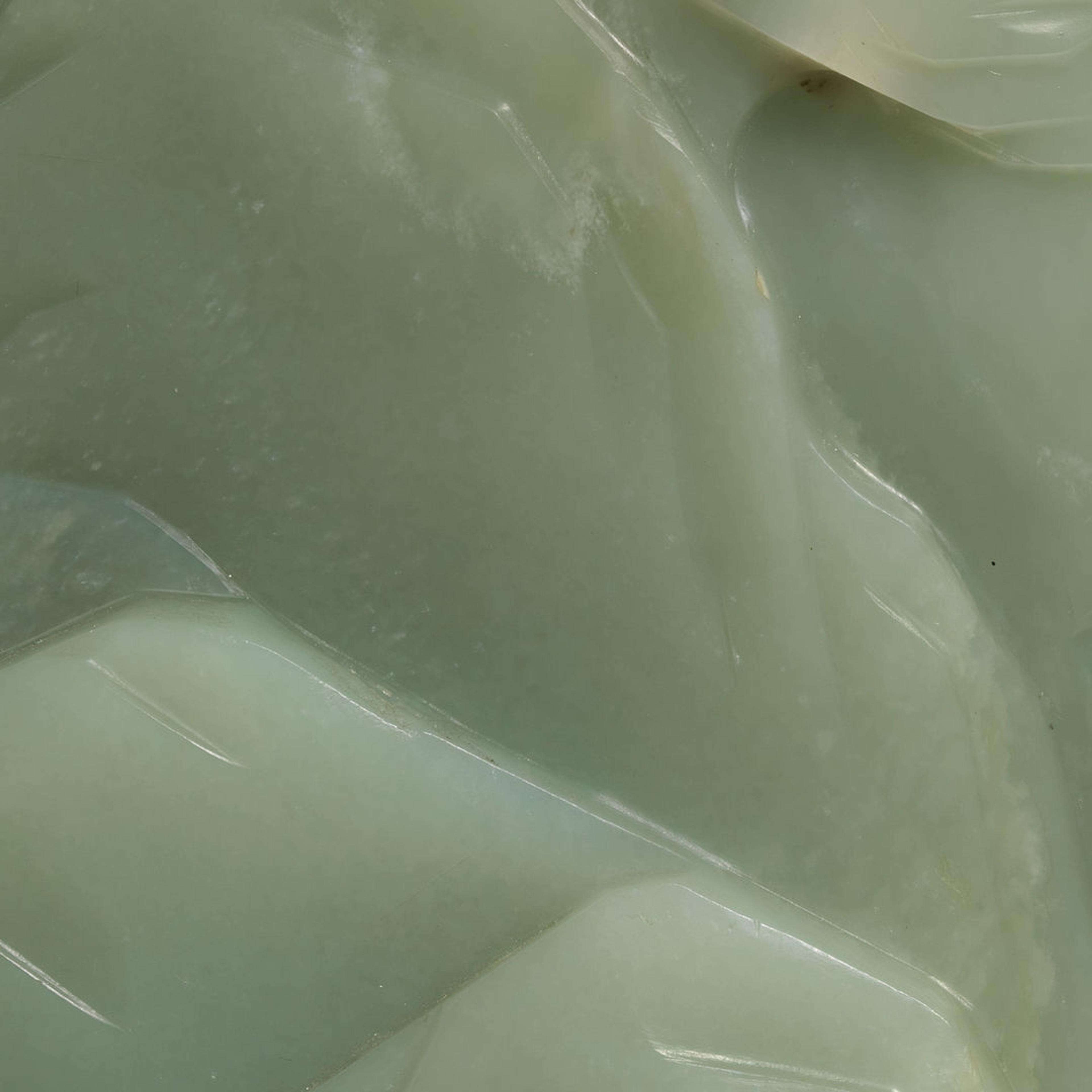 Extreme close-up of a carved piece of green jade