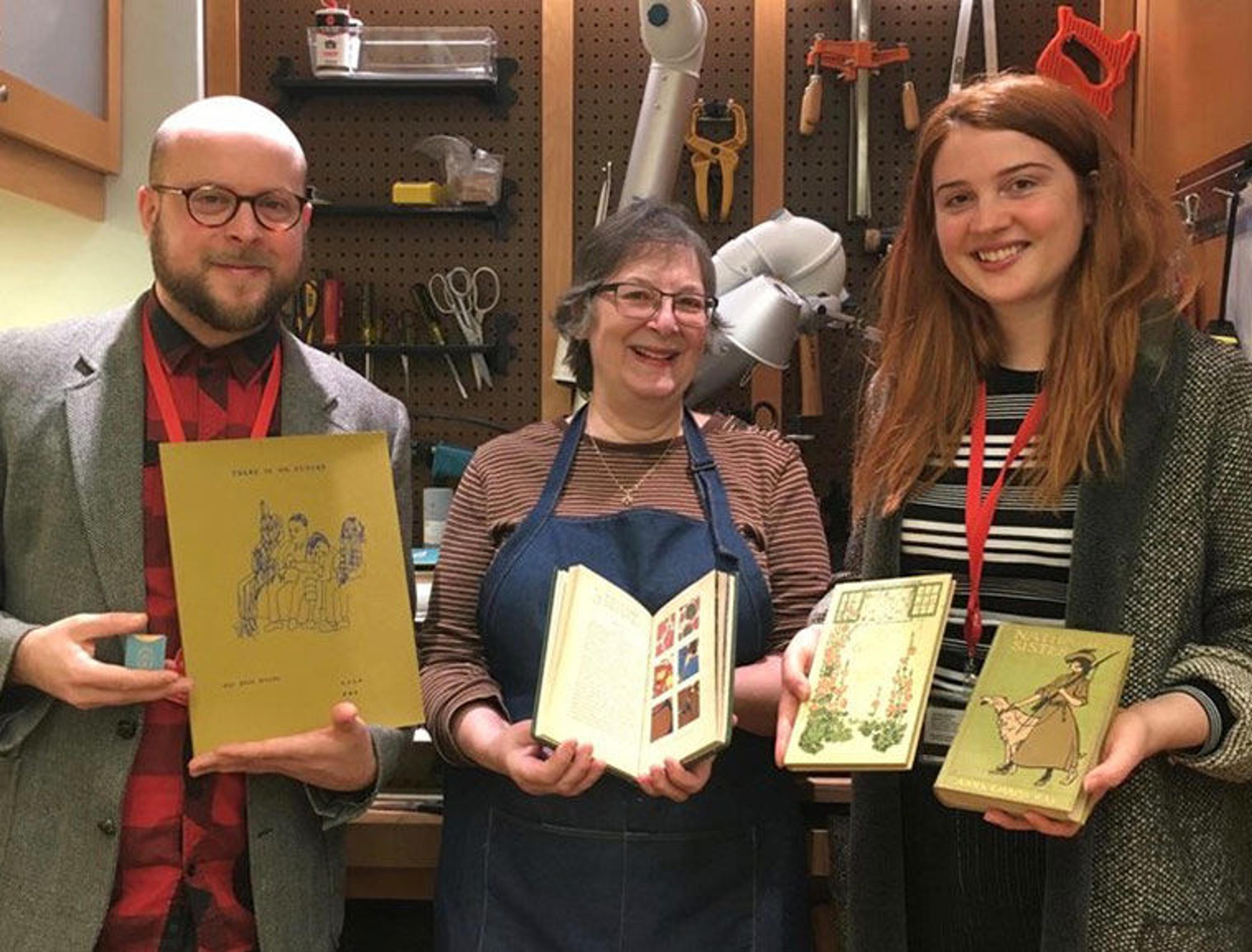 Watson staff holding books