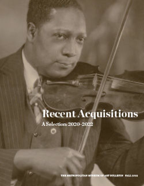 a black-and-white photograph of a man with dark skin tone in a pinstriped suit playing a violin