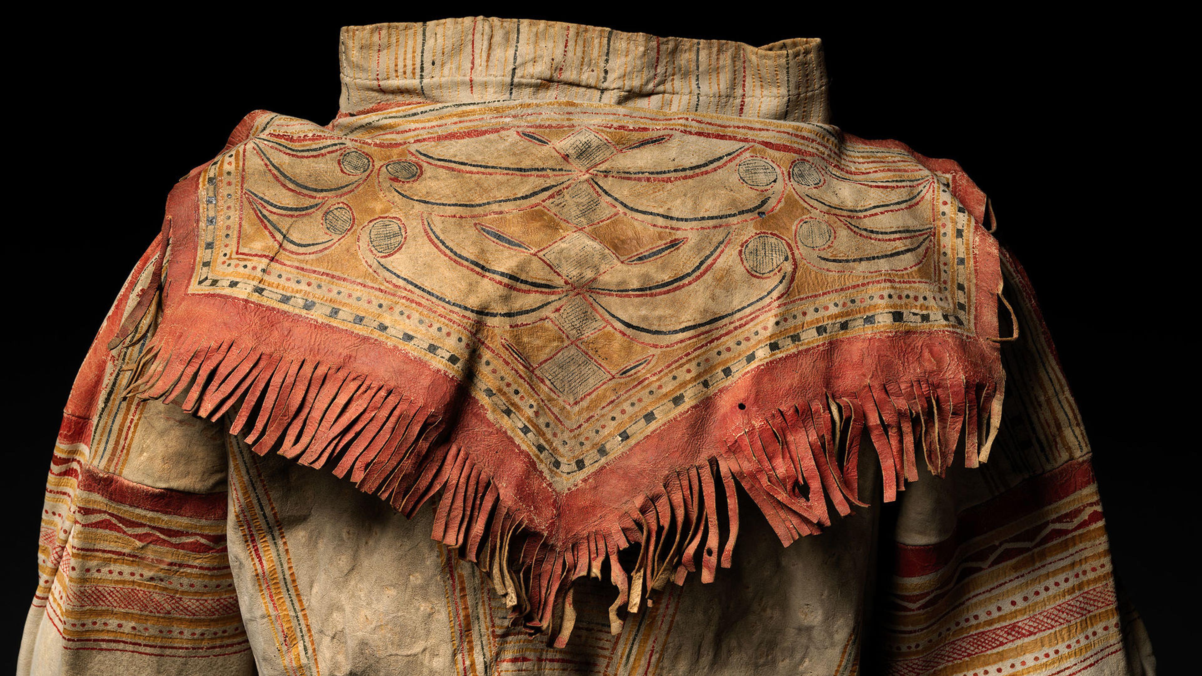 Detail of native-tanned leather and pigment fringe on the back side of a Naskapi Innu man's coat
