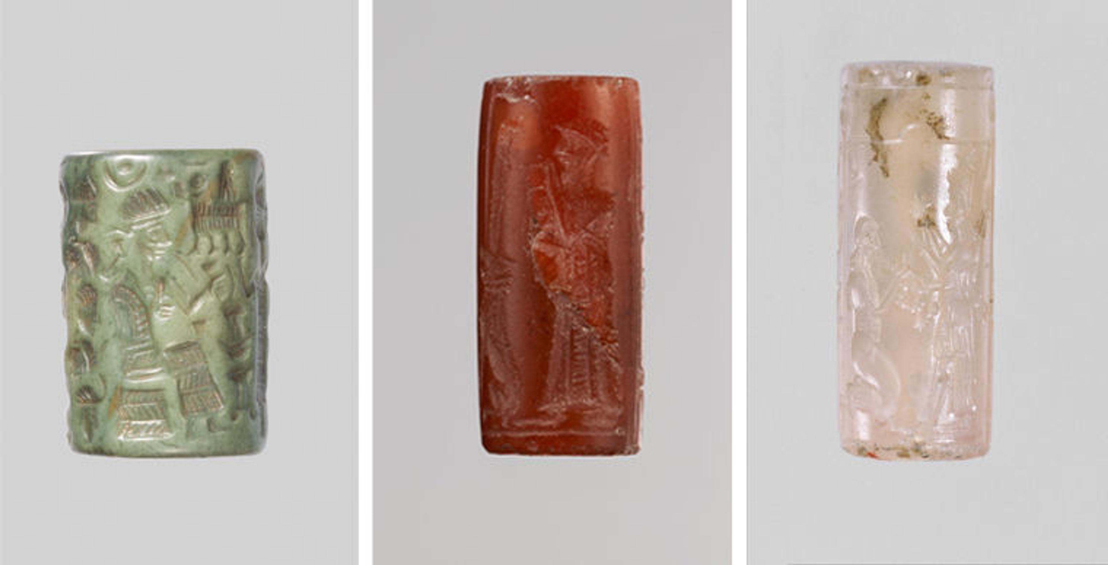 Three cylinder seals made from different stones. From left to right: one made from a green colored rock, quartzite; one made out of a red gemstone known as carnelian, and one made of a translucent pink gemstone chalcedony. 