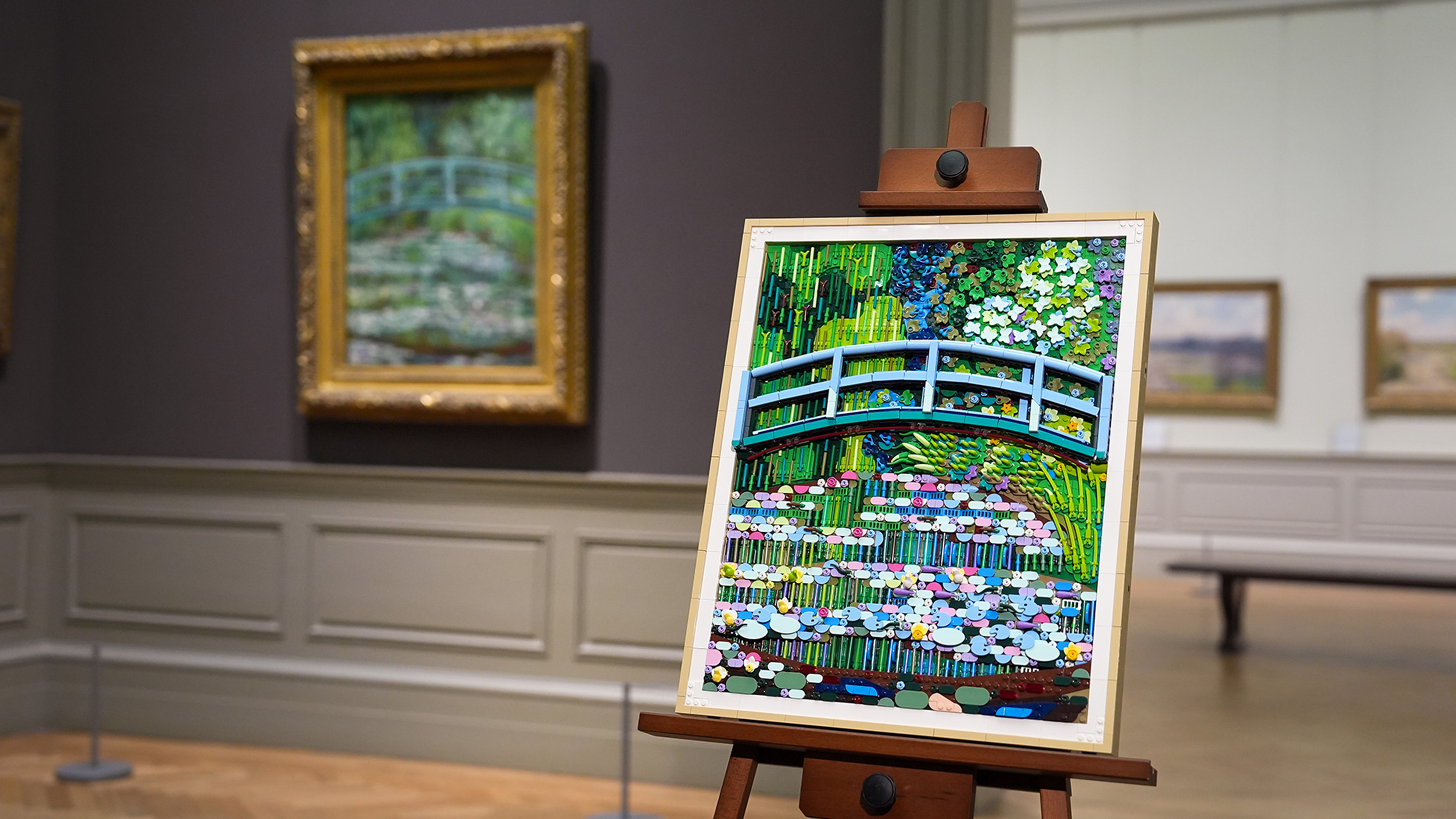 A woman holding the LEGO® Art set.