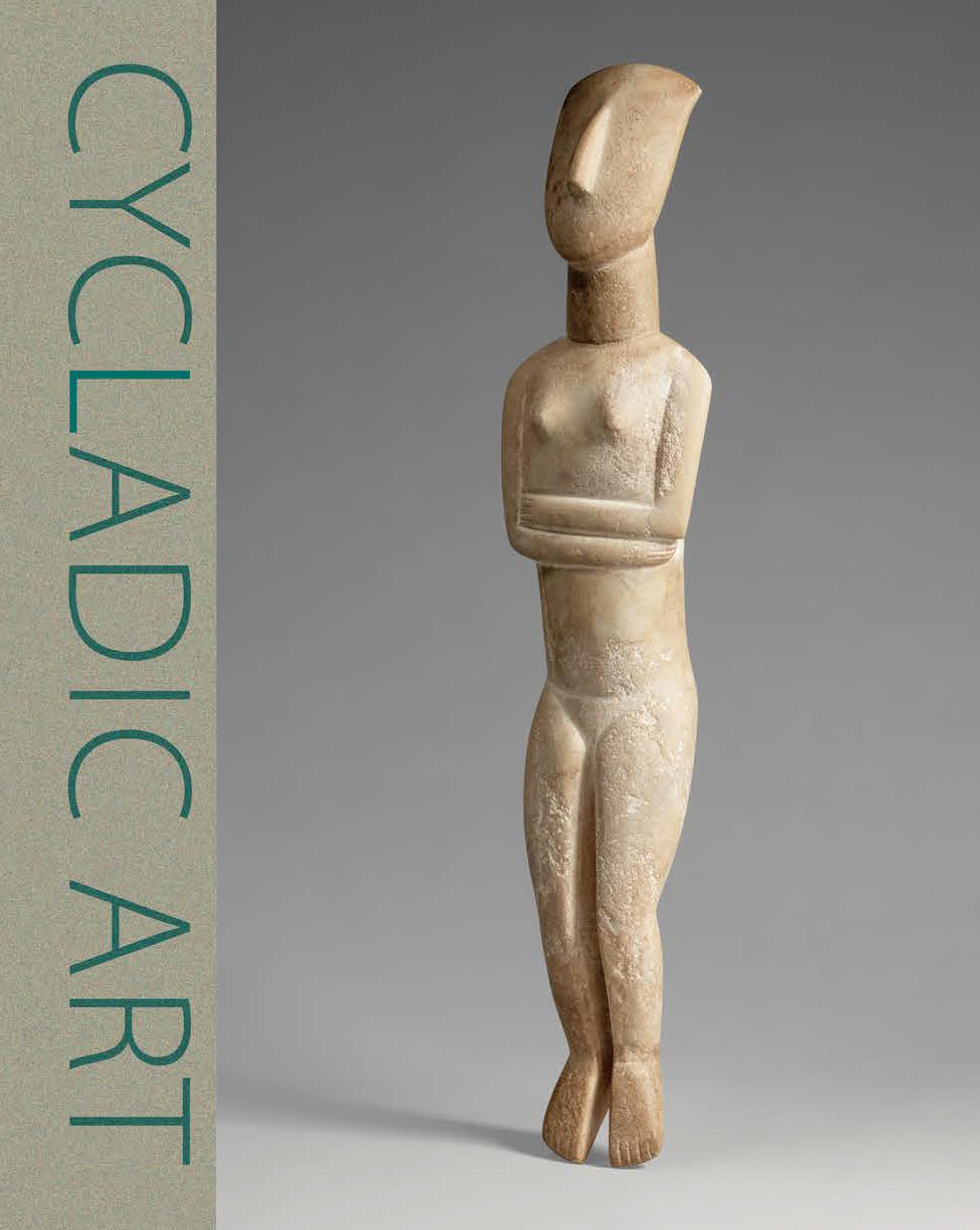 an ancient stone female figure, facing to the left, with arms crossed