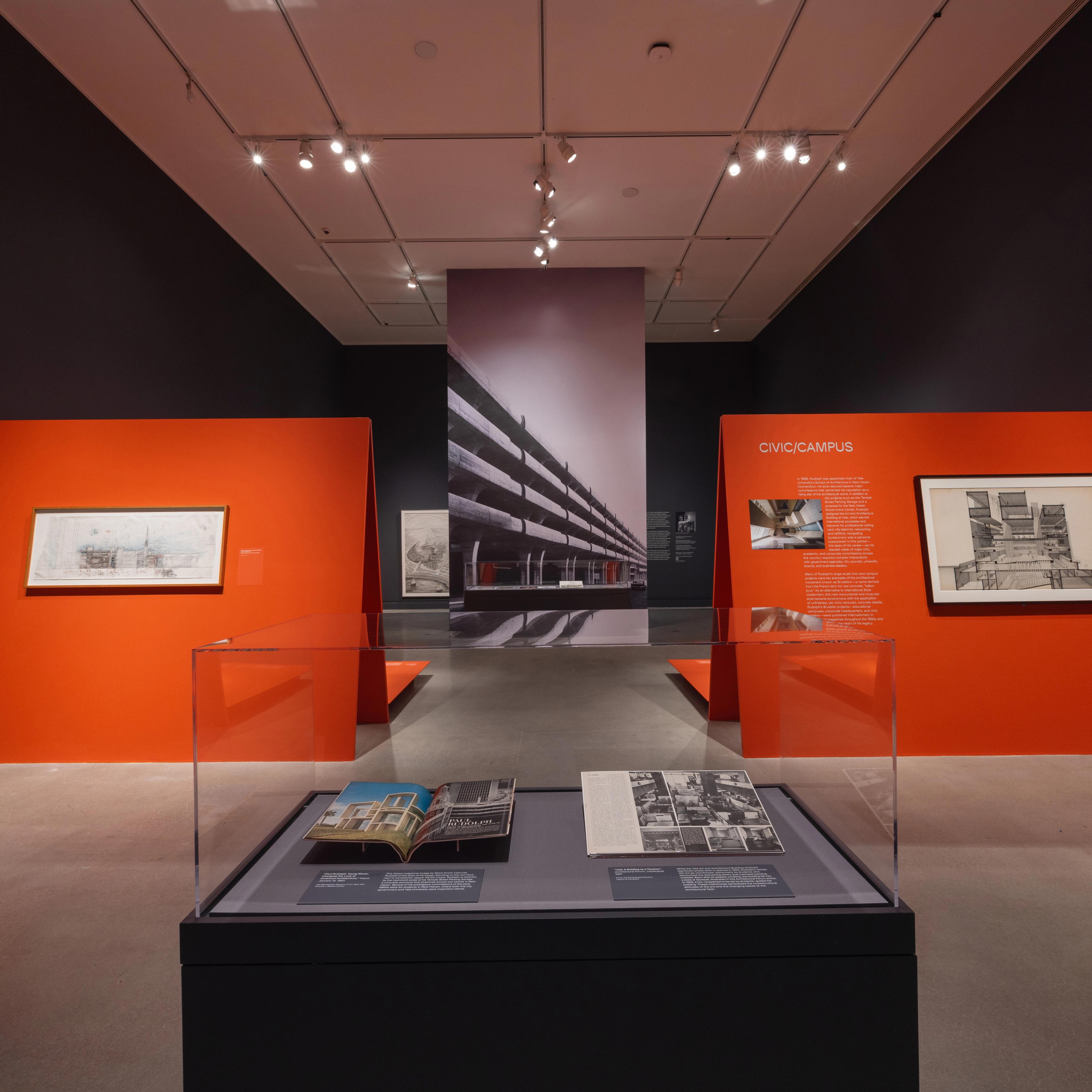Display case of books within a larger exhibition