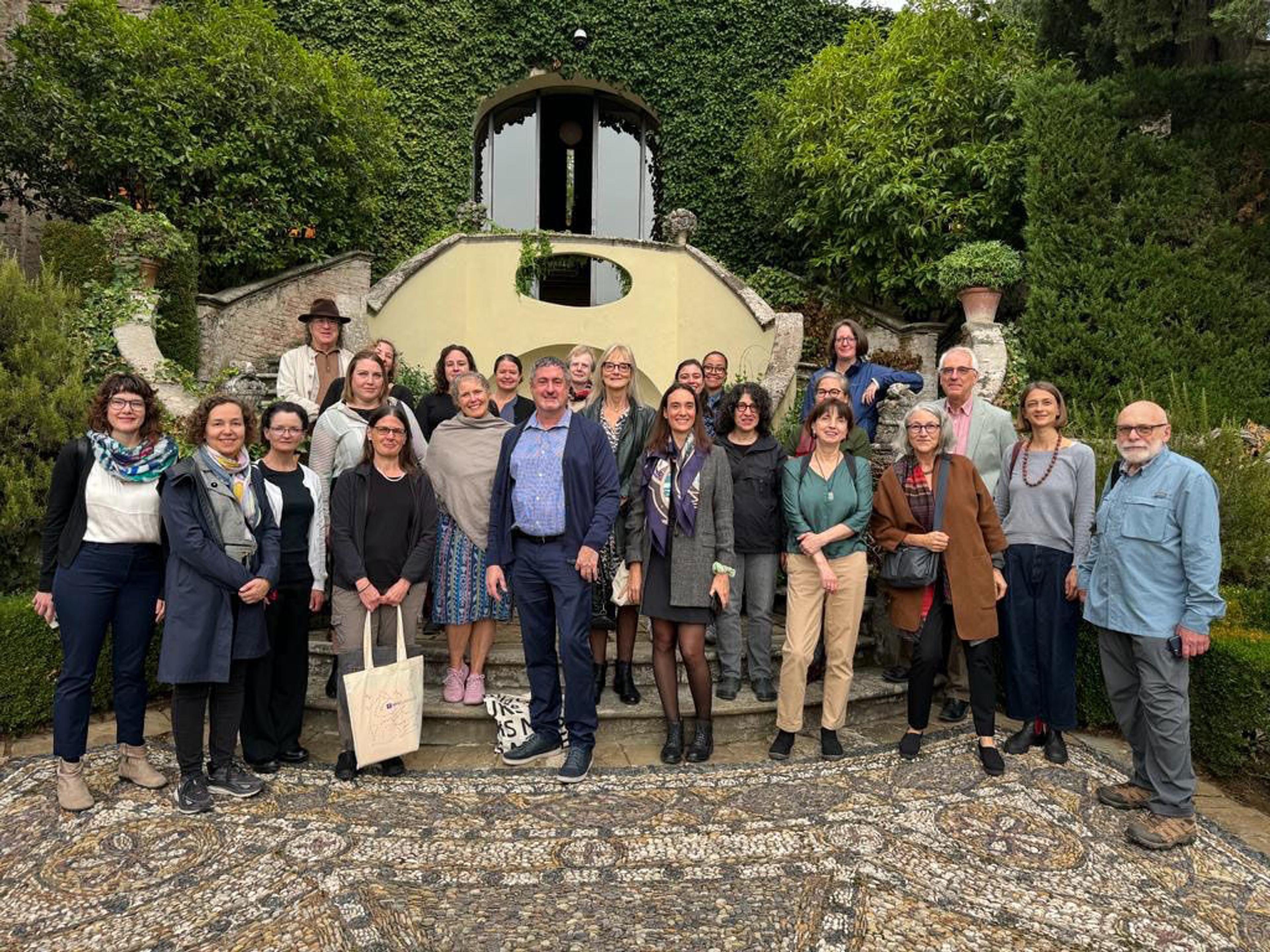 Group portrait of all members of the study tour on a staircase outdoors