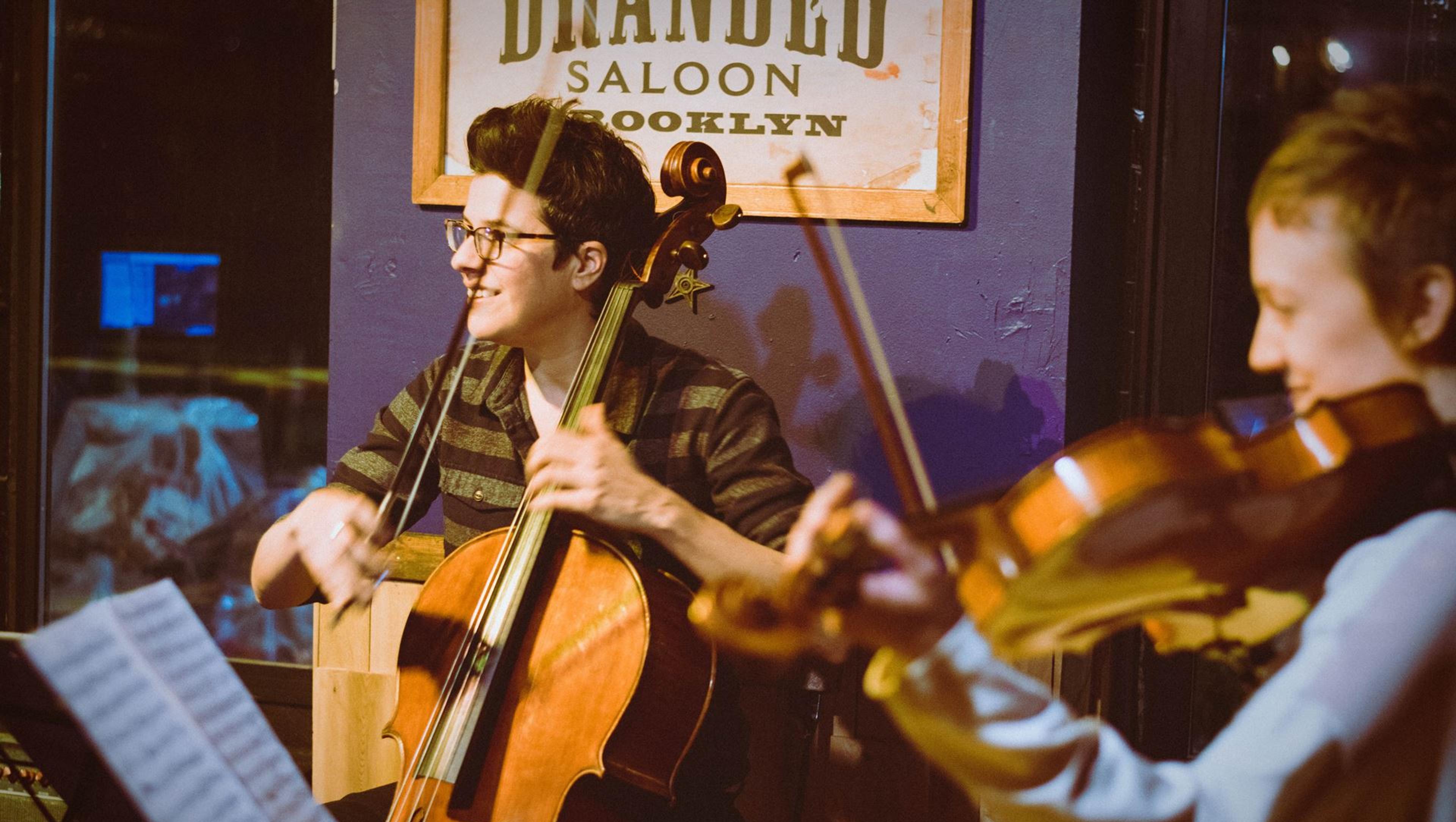 A cellist and violinist during a performance.