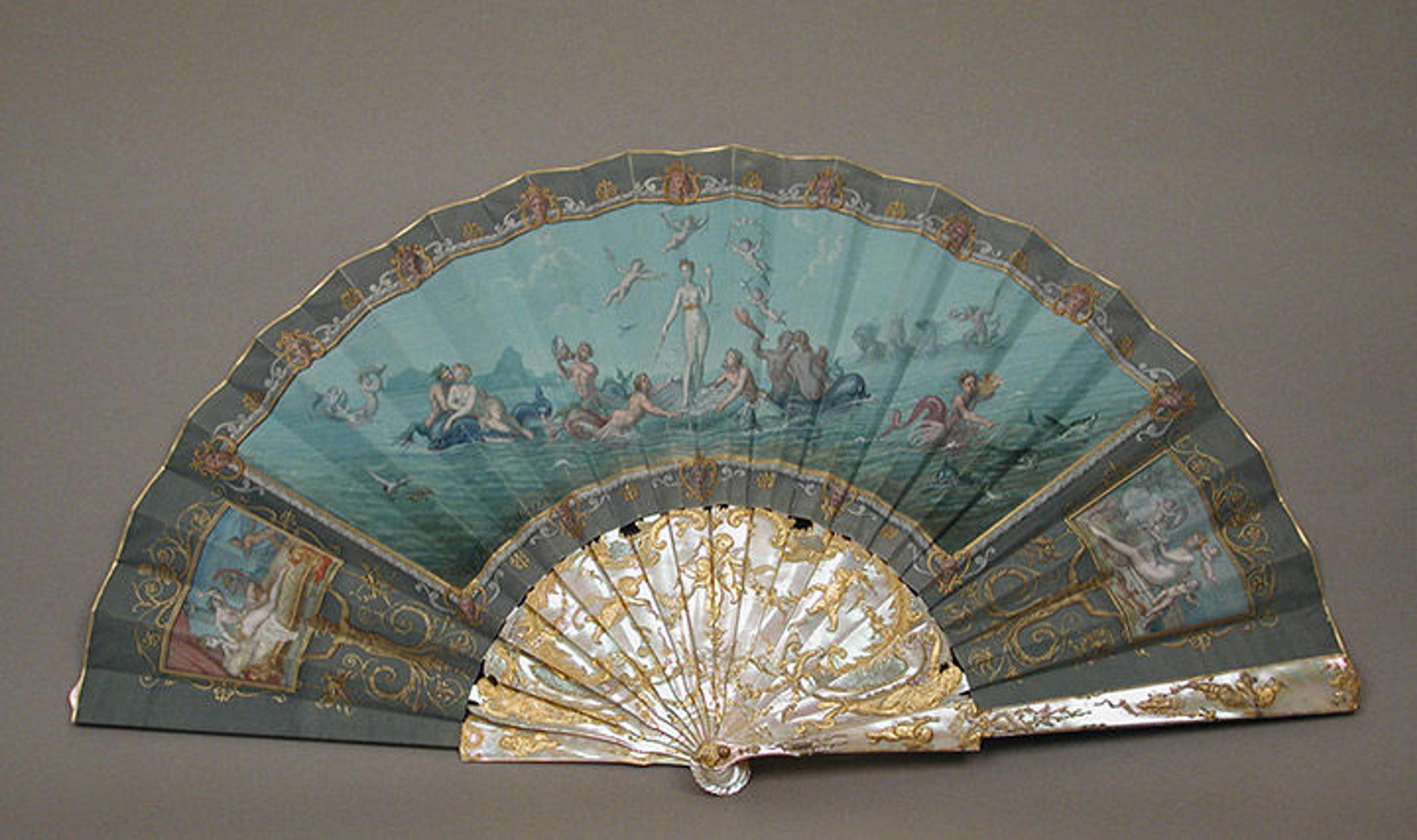 Turquoise fan depicting Venus on a half-shell in the ocean with Cupids