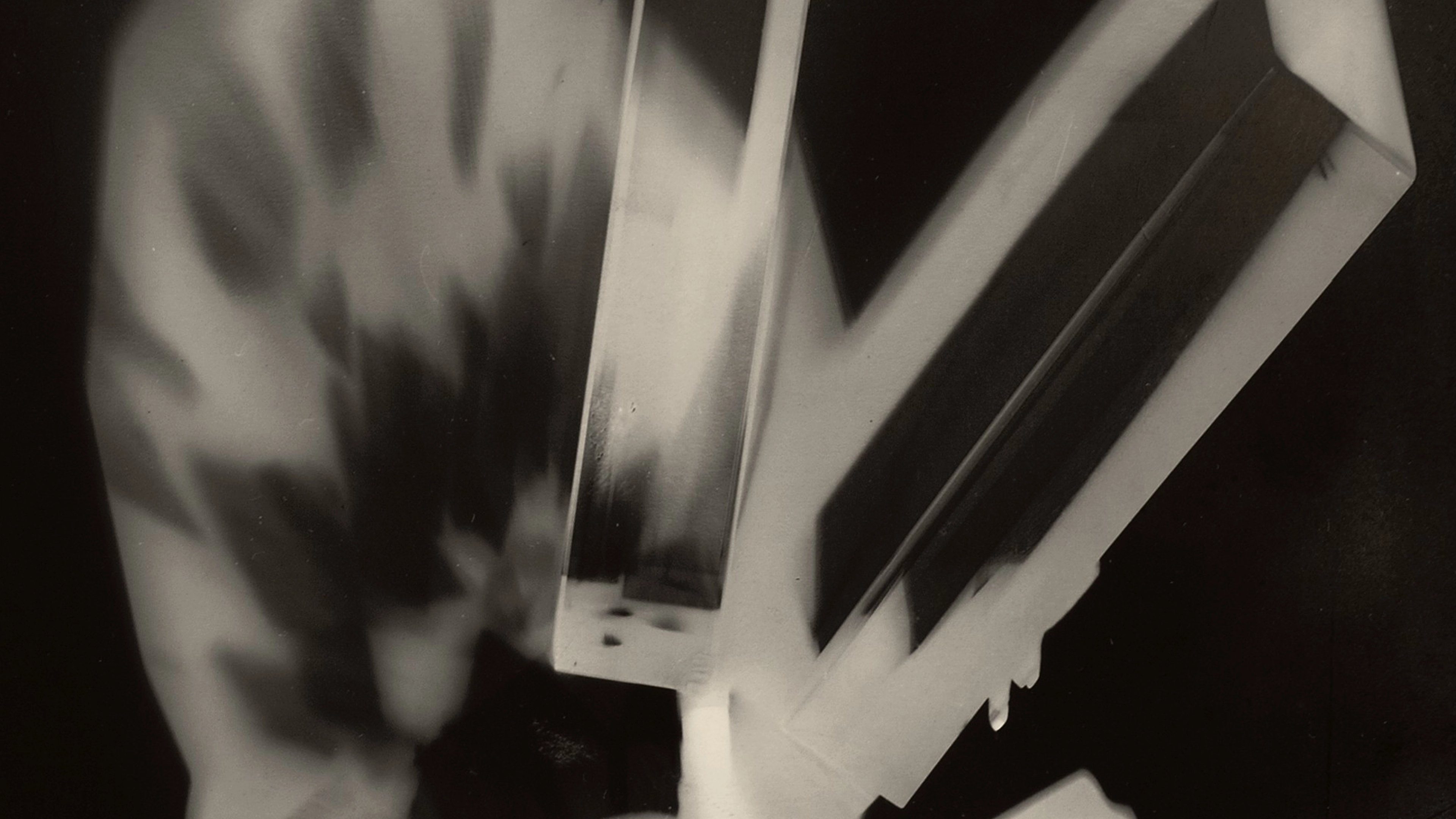 Detail of an abstract black-and-white Rayograph of a prism.