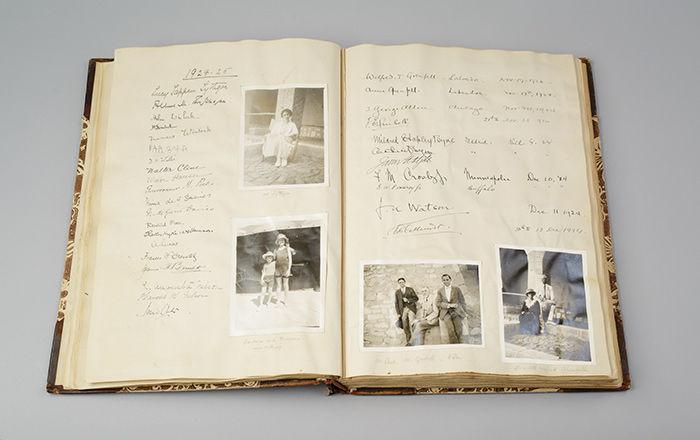A spread from a book with black and white photos and handwritten text