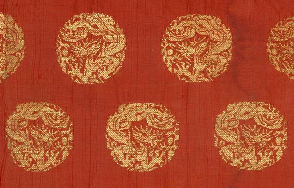Textile with coiled dragons
