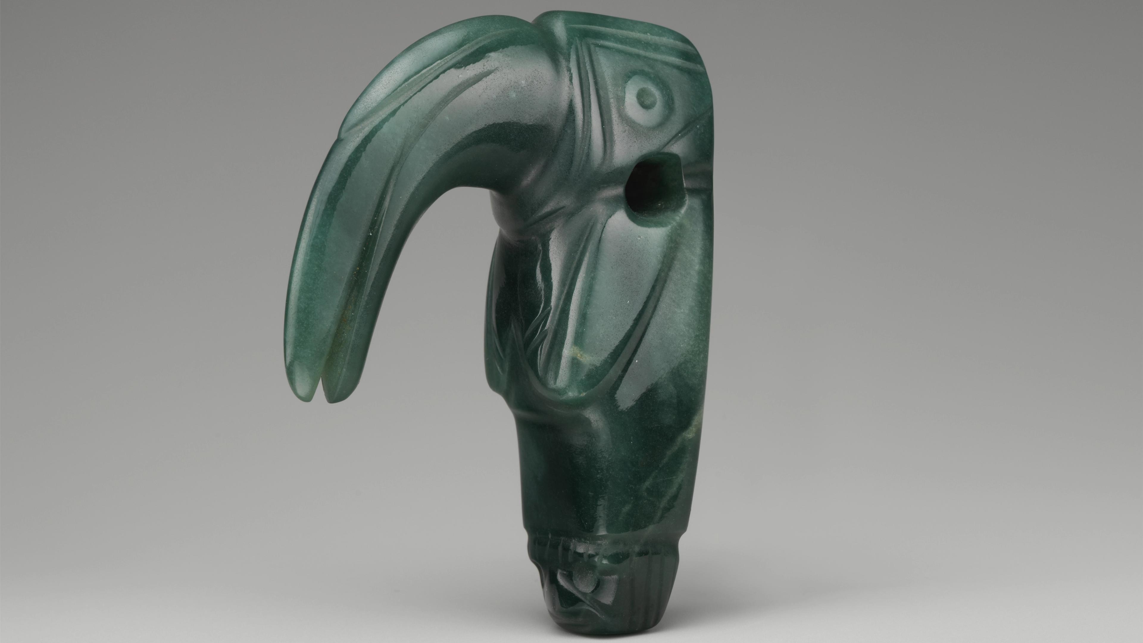 Jadeite pendant in the shape of an anthropomorphized toucan