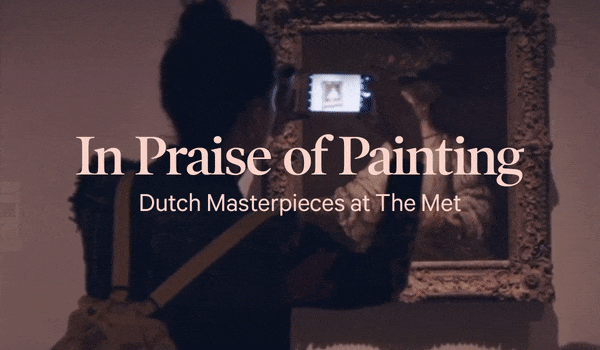 A woman takes a photo of a Dutch masterpiece