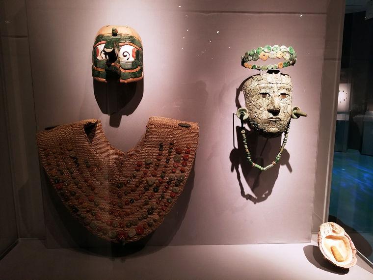 View of an exhibition installation showing objects from an ancient Maya funeral tomb