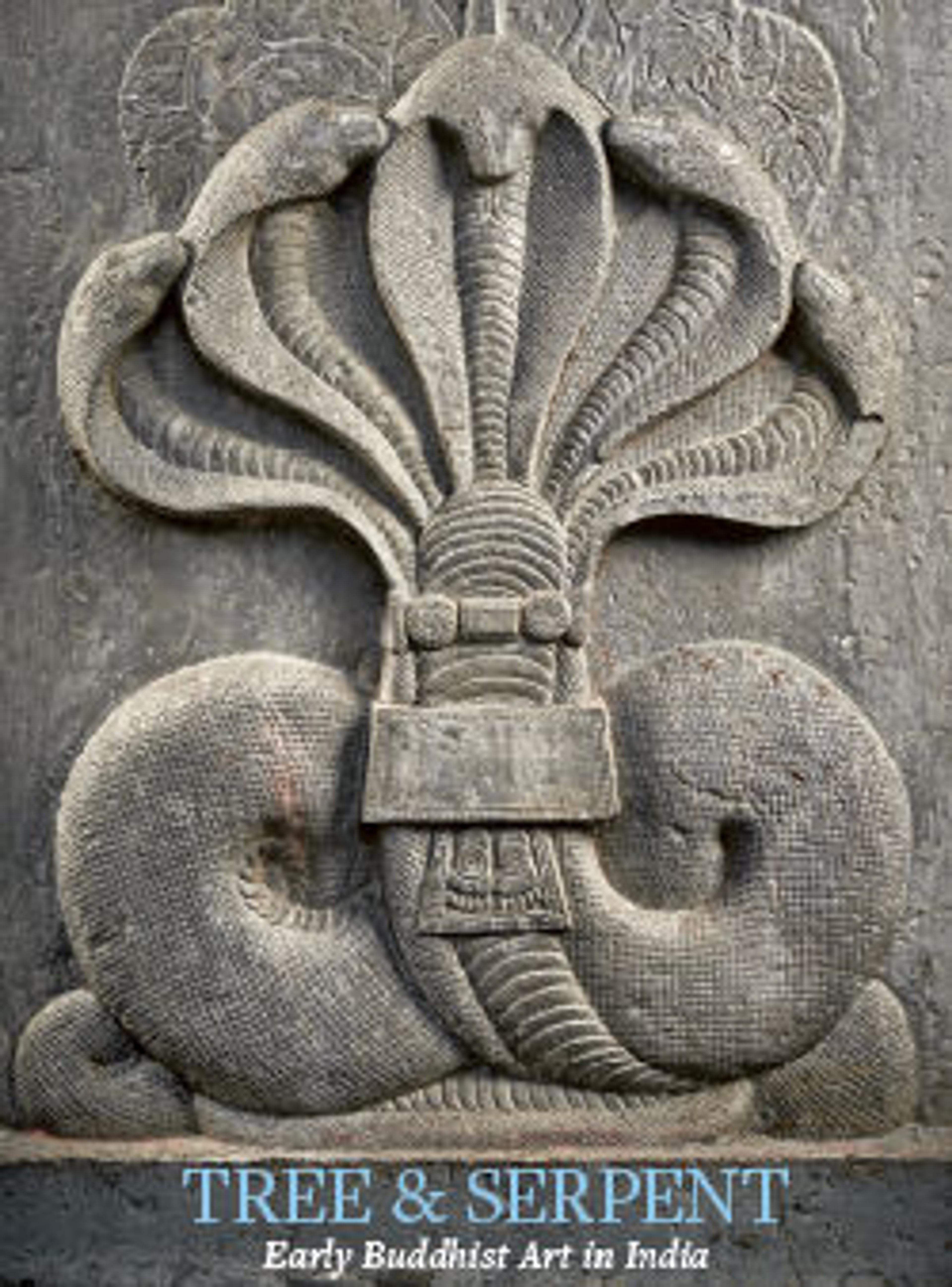 a stone carving of a majestic five-headed snake with leaves carved behind its heads