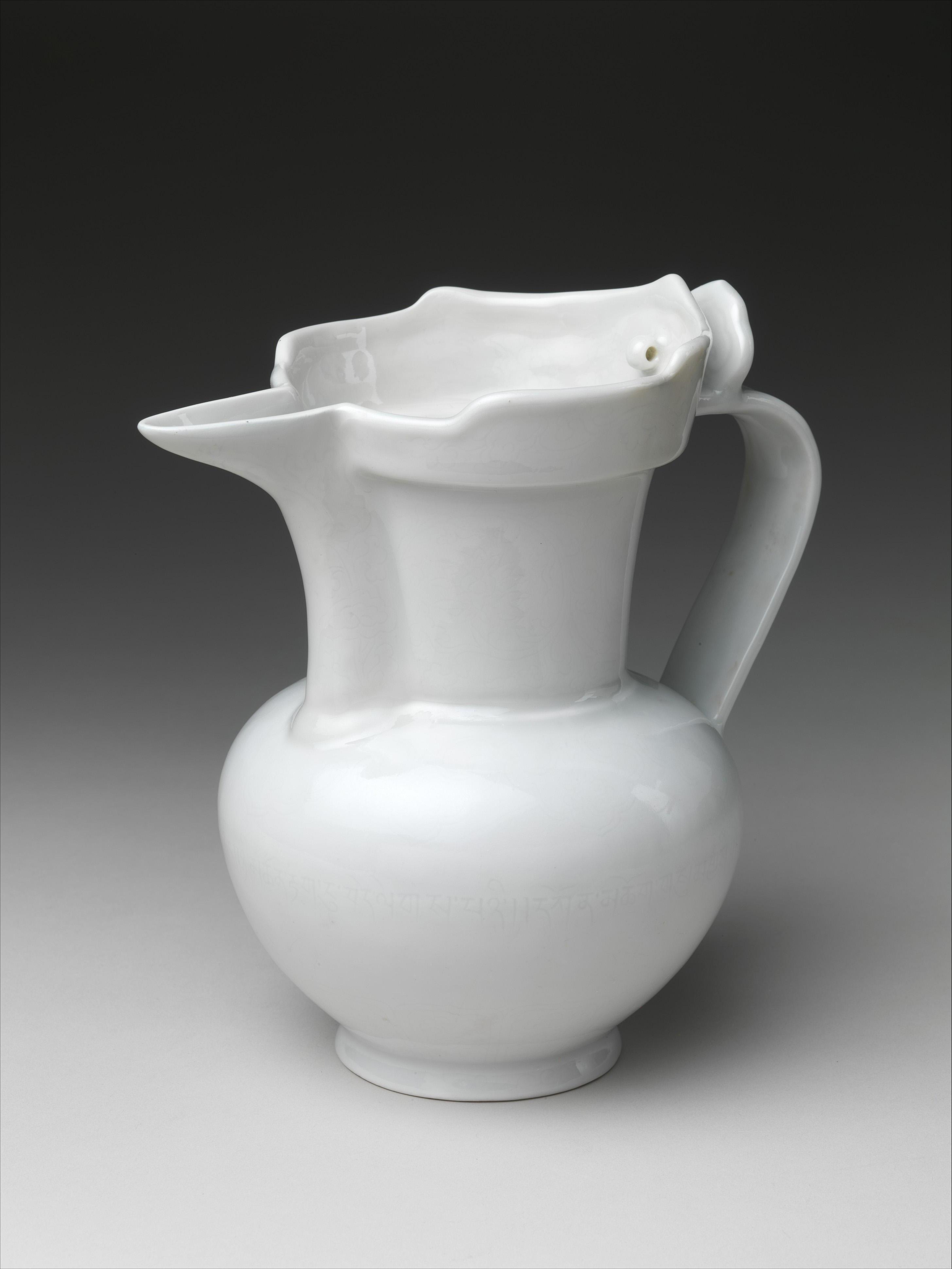White porcelain ewer in the shape of a monk's cap.