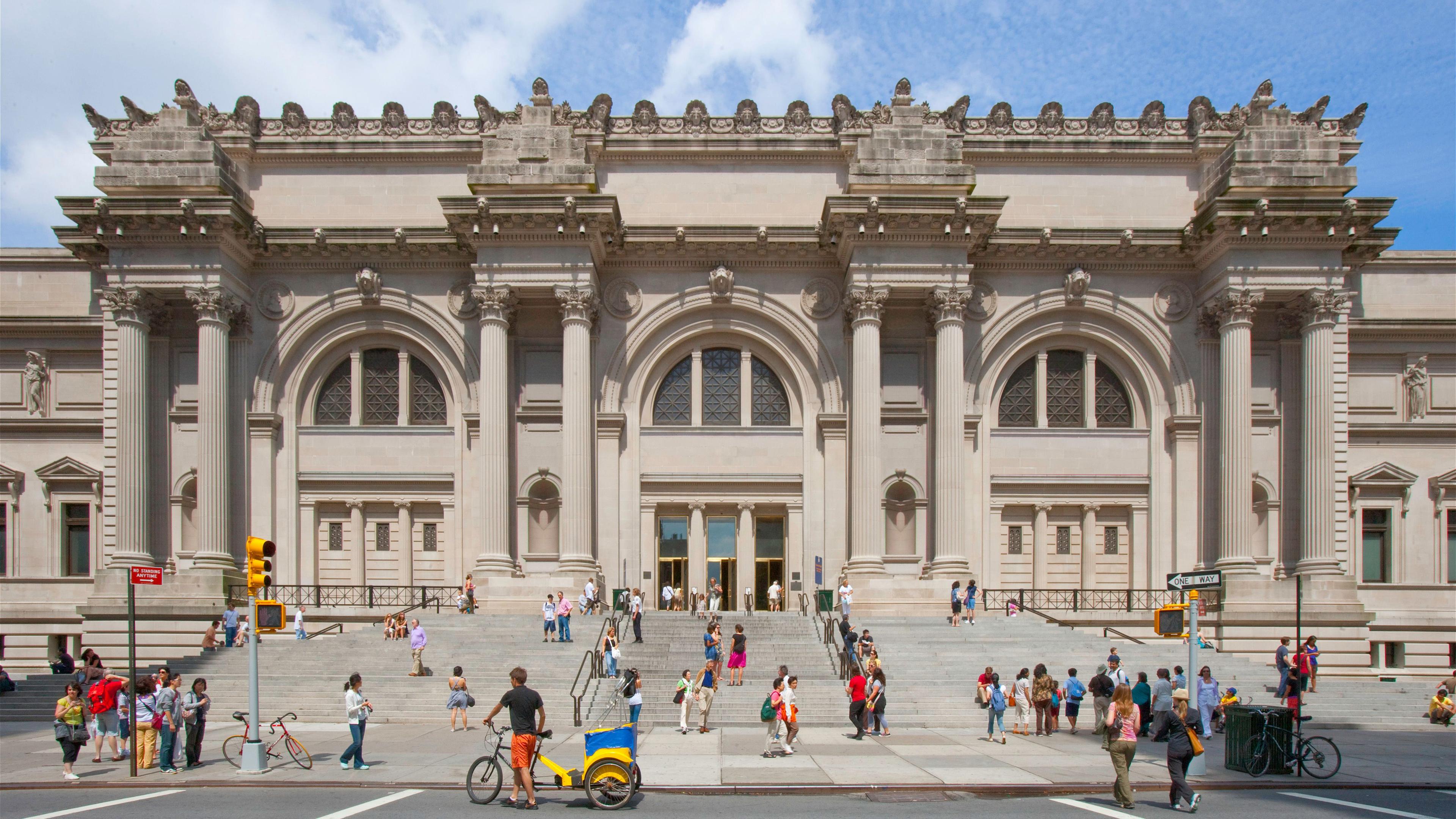 Exterior view of the main entrance of The Met Fifth Avenue on a sunny day.