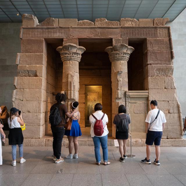 Group in gallery looking at the Temple of Dendur.