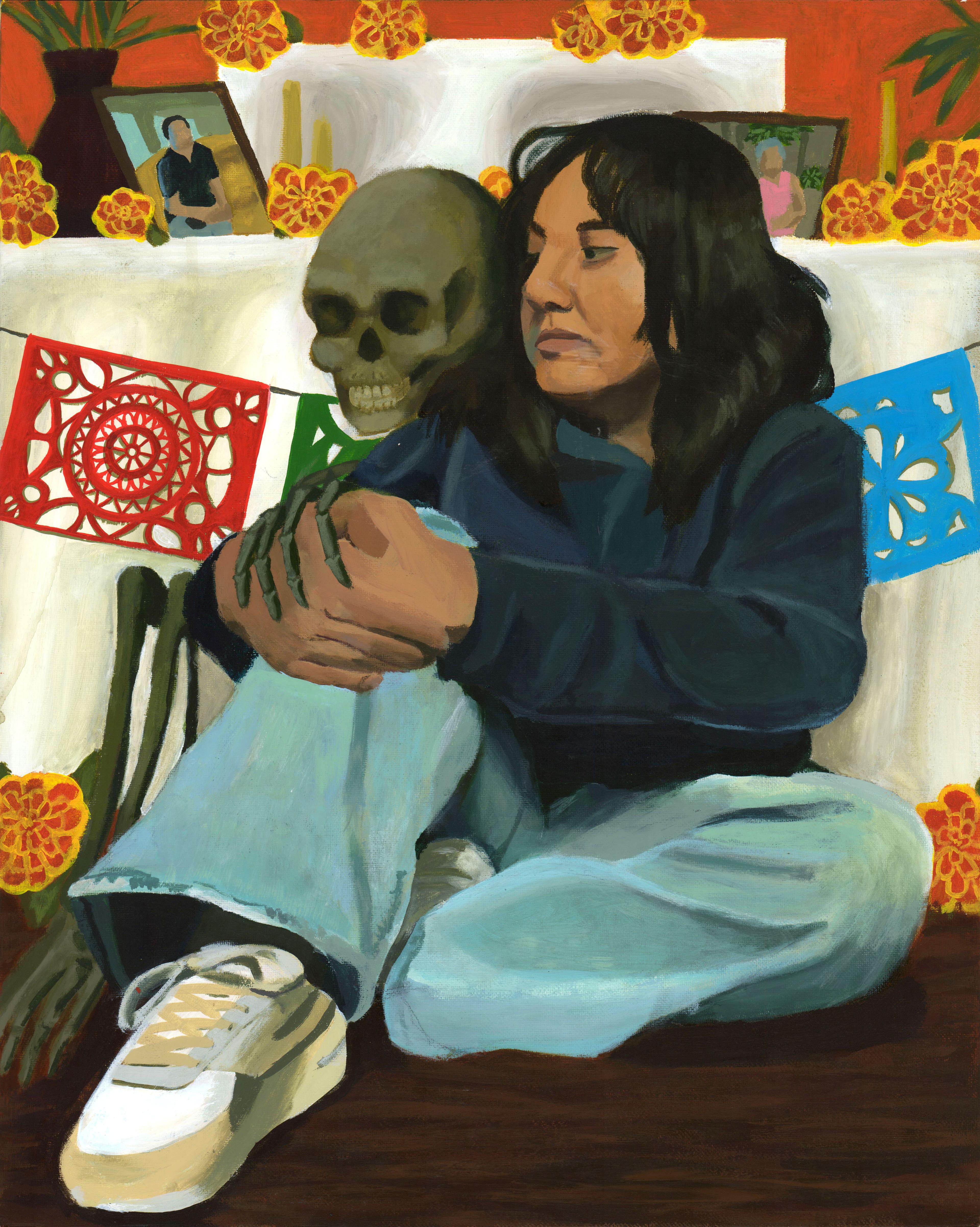 Acrylic painting of an adolescent girl sitting on a brown floor, leaning against a table covered with a white tablecloth, and clasping her hands together on top of her raised right knee. She wears light blue jeans, white sneakers, and a dark blue long-sleeved shirt. She faces to the left and has long black hair that extends beyond her shoulders. Directly next her to the left, a gray skeleton sits right up against her, with one of its bony hands resting on top of her hands. The skull is directly next to her face. Yellow and red flowers adorn the tabletop and floor around the girl. A small framed portrait photo of a person leans against a potted plant on the table top to the left. The wall behind the table is a bold red. Ornate red, green, and blue paper cutout flags hang from a wire in front of the tablecloth, directly behind the girl's back.