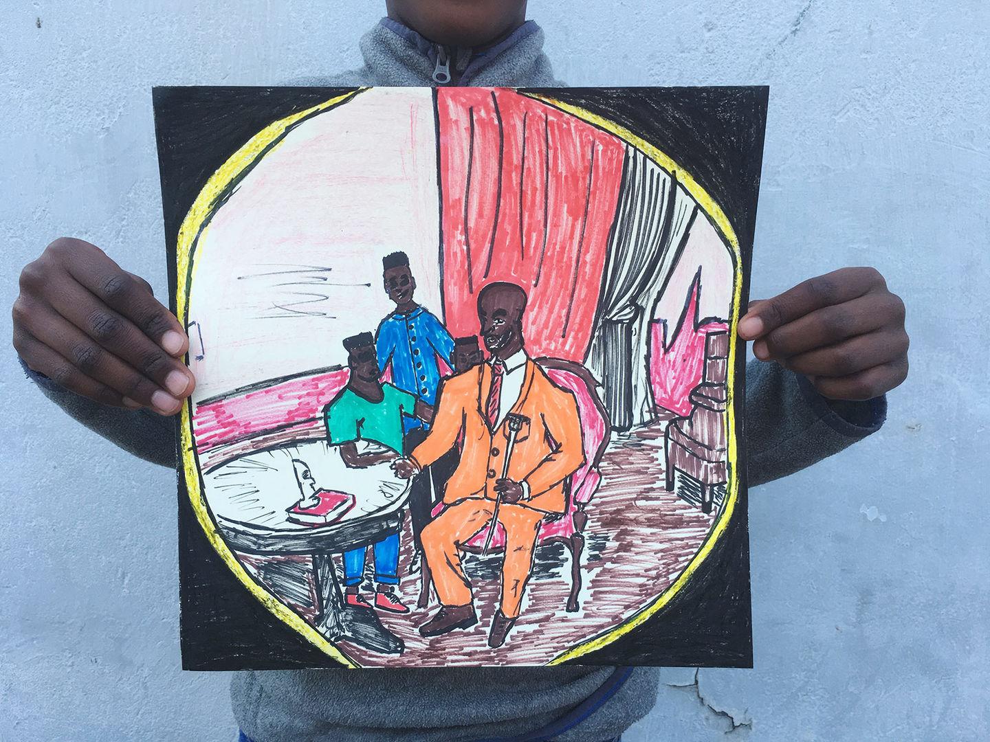 Thabo holds up his artwork depicting his family wearing colorful shades of orange, blue, and green gathered around a table.