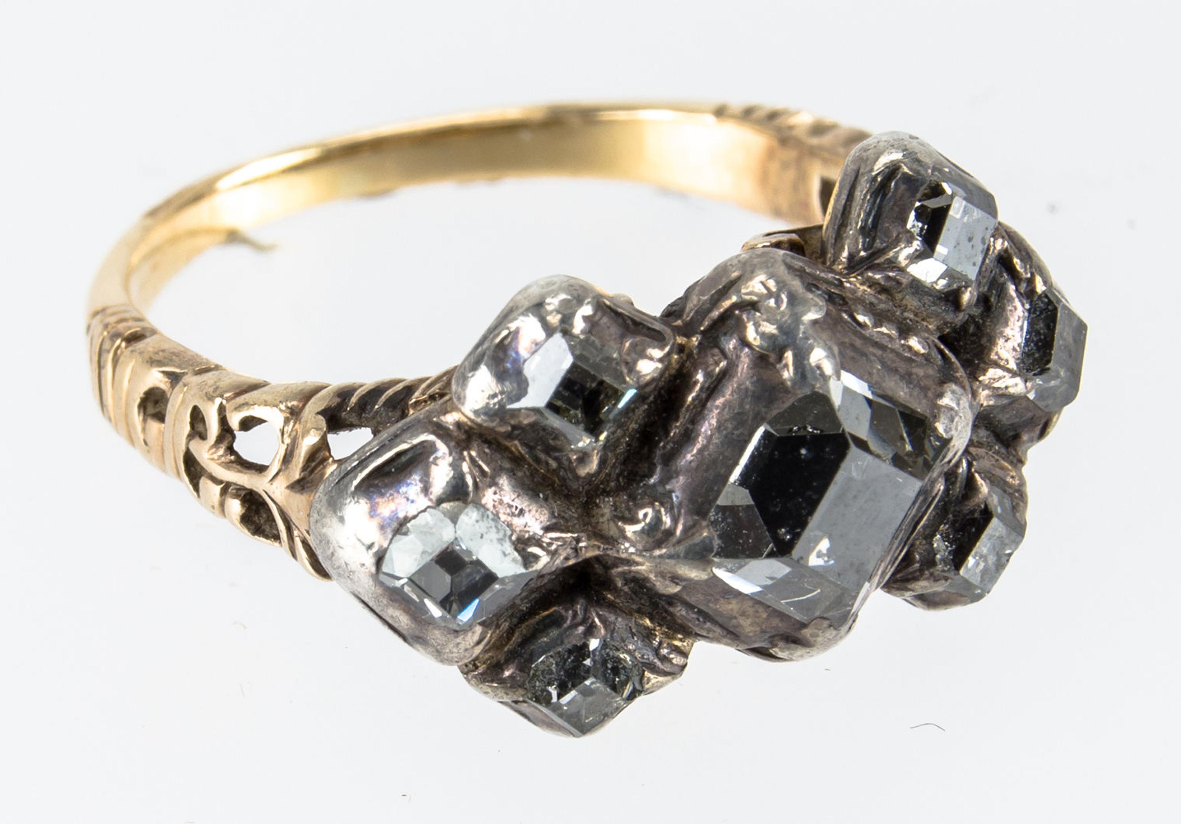 RIng with seven table-cut diamonds