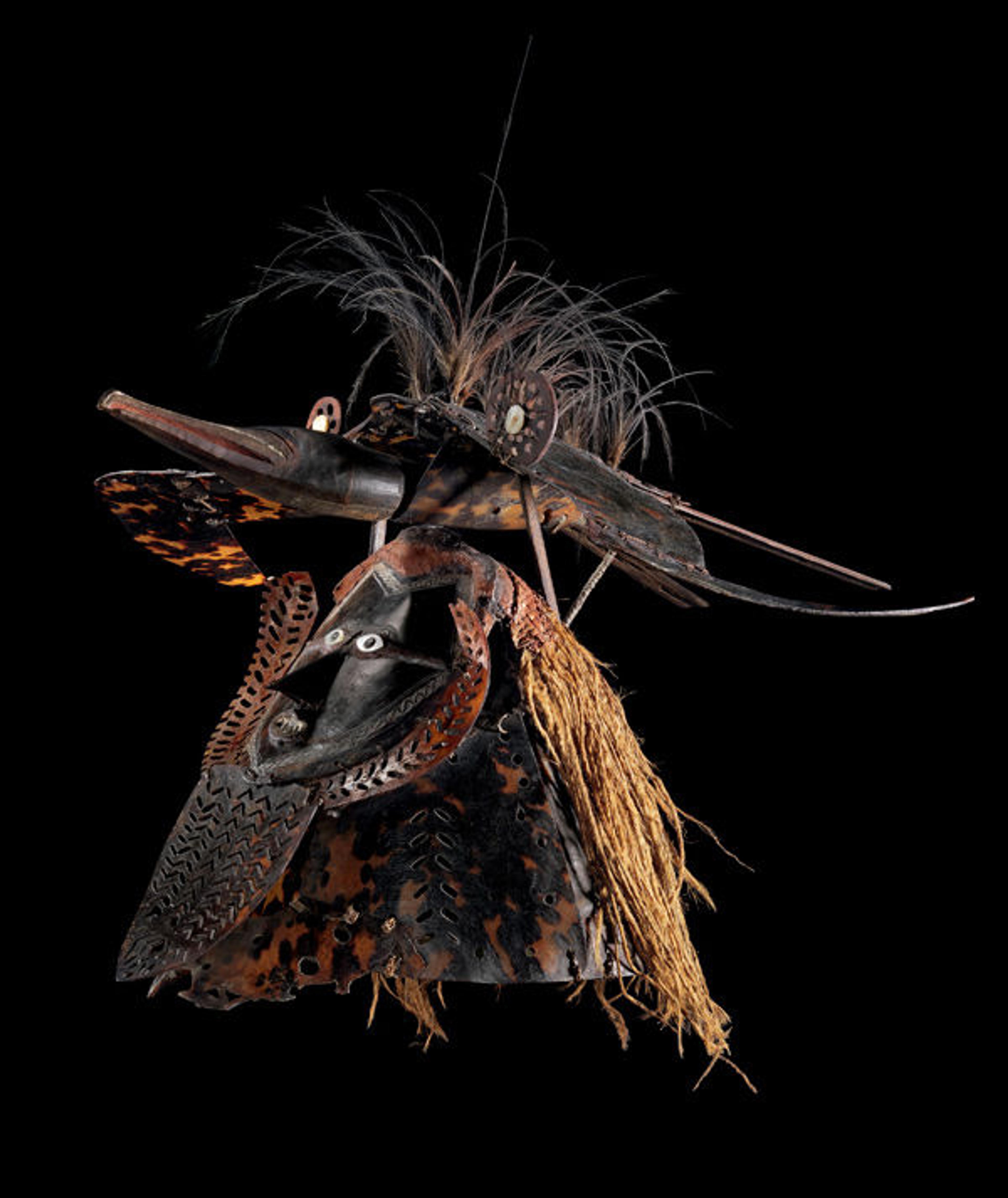 Mask (Buk, Krar, or Kara), mid- to late 19th century. Australia, Mabuiag Island, Queensland, Torres Strait. Turtle shell, wood, cassowary feathers, fiber, resin, shell, paint; H. 21 1/2 x W. 25 x D. 22 3/4 in. (54.6 x 63.5 x 57.8 cm). The Metropolitan Museum of Art, New York, The Michael C. Rockefeller Memorial Collection, Purchase, Nelson A. Rockefeller Gift, 1967 (1978.412.1510)