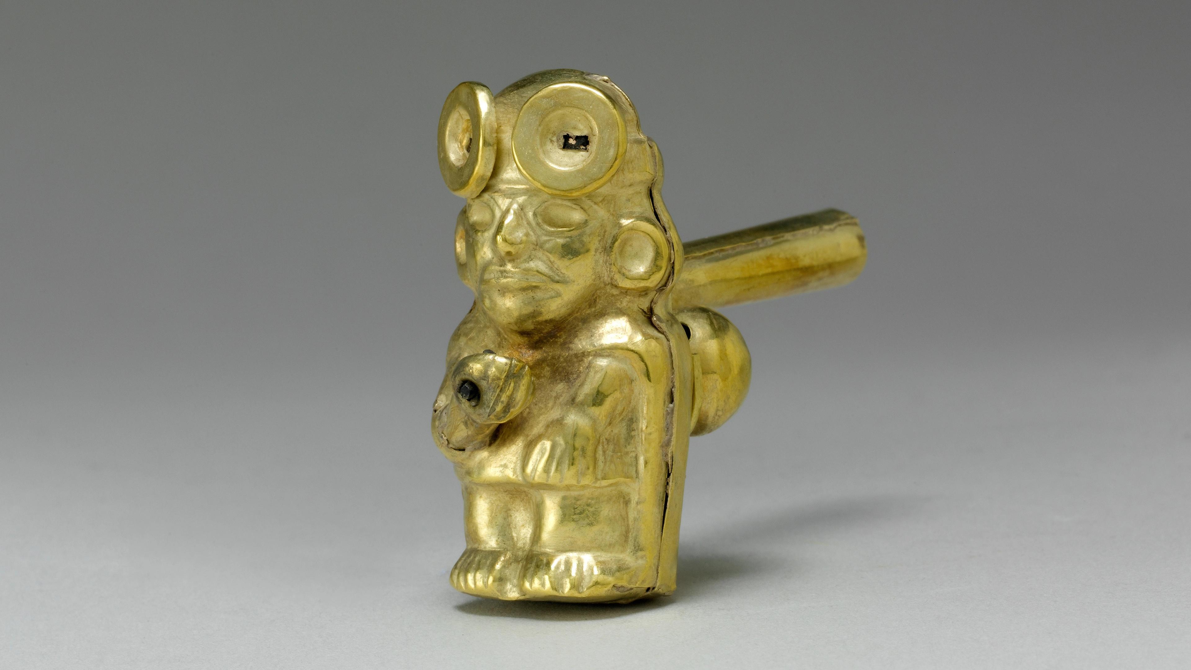 Small hollow gold figure whistle