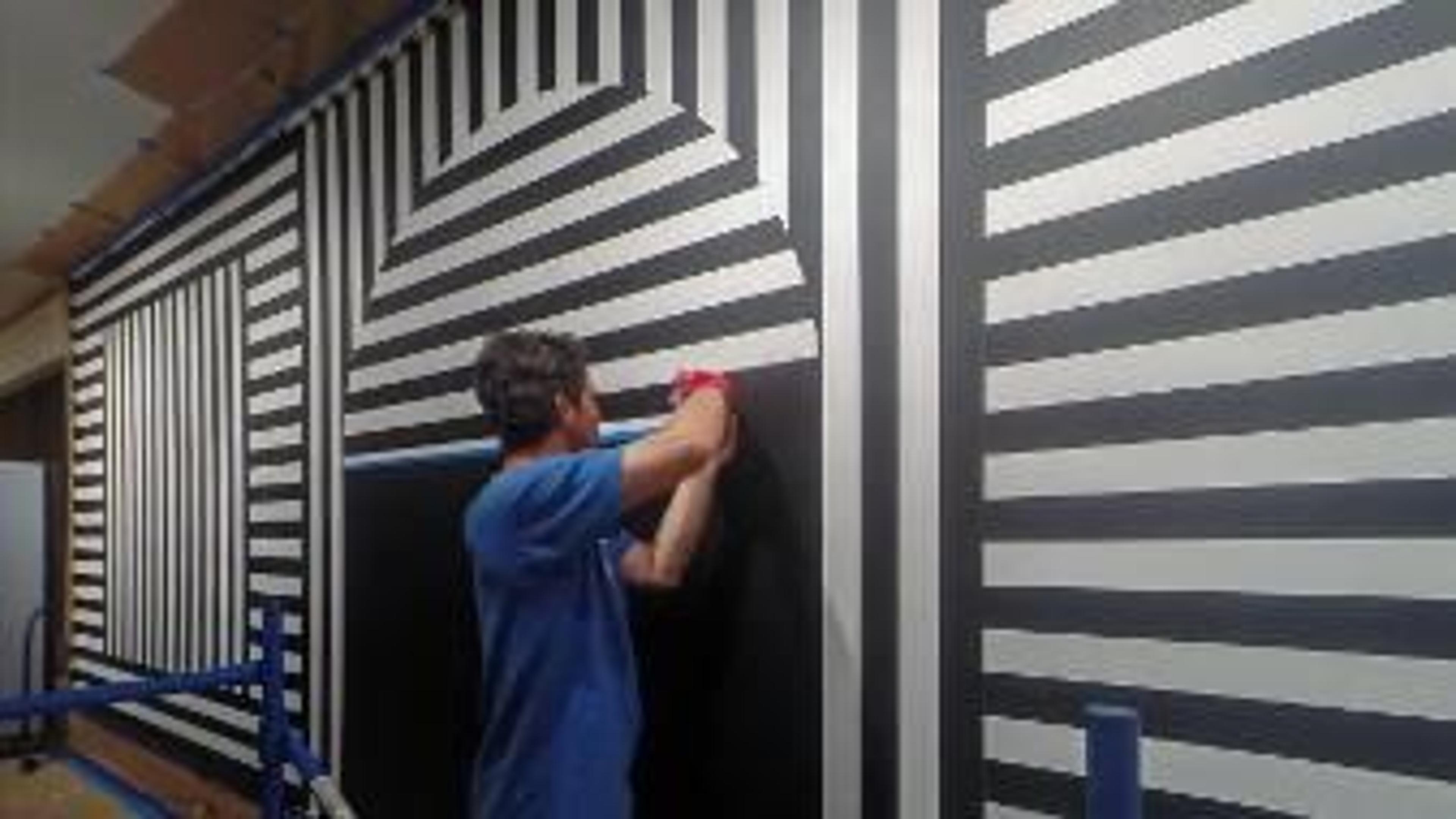 People installing Sol LeWitt's work in the gallery