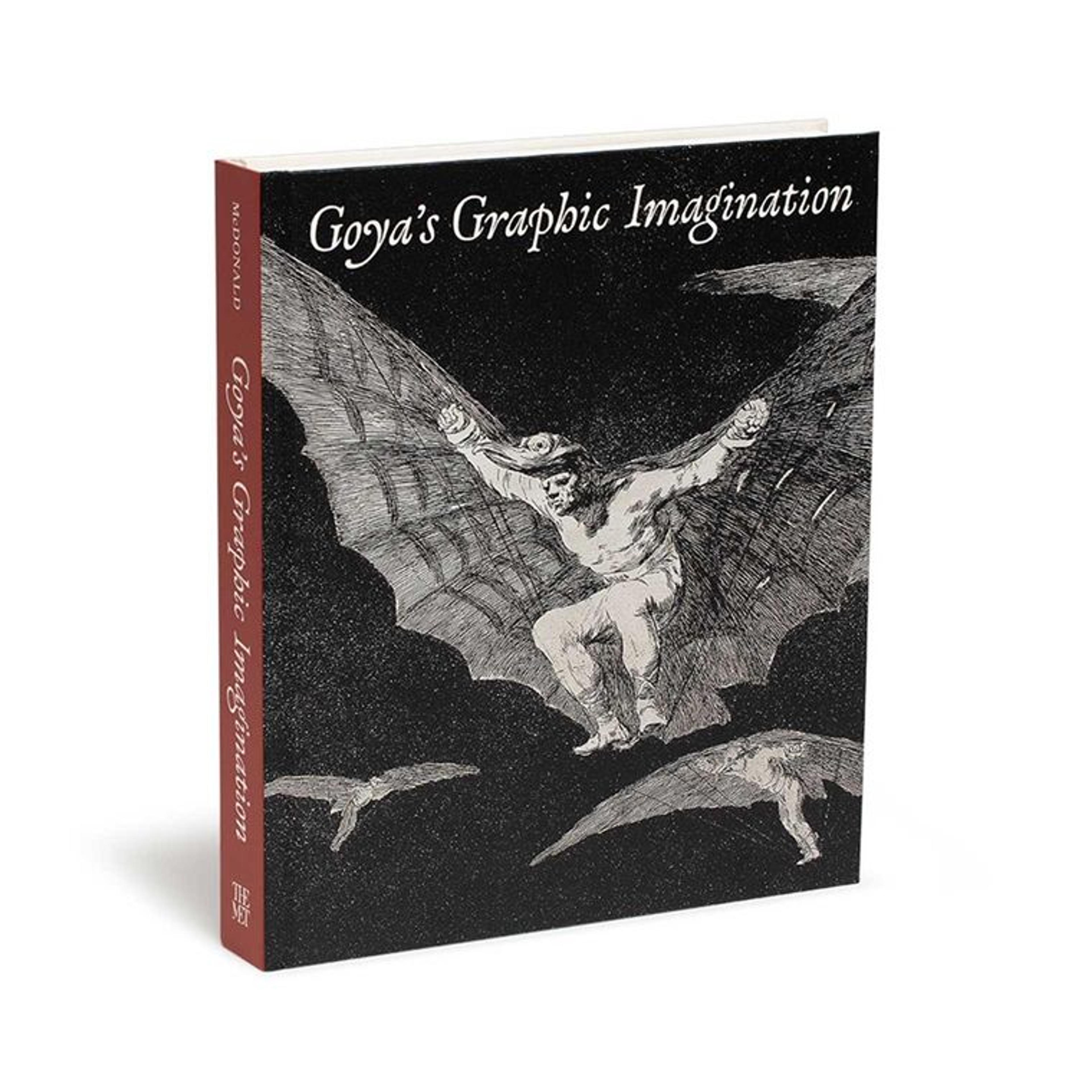 Photograph of a book with a cover drawing of stron naked man jumping with wings titled "Goya's Graphic Imagination"