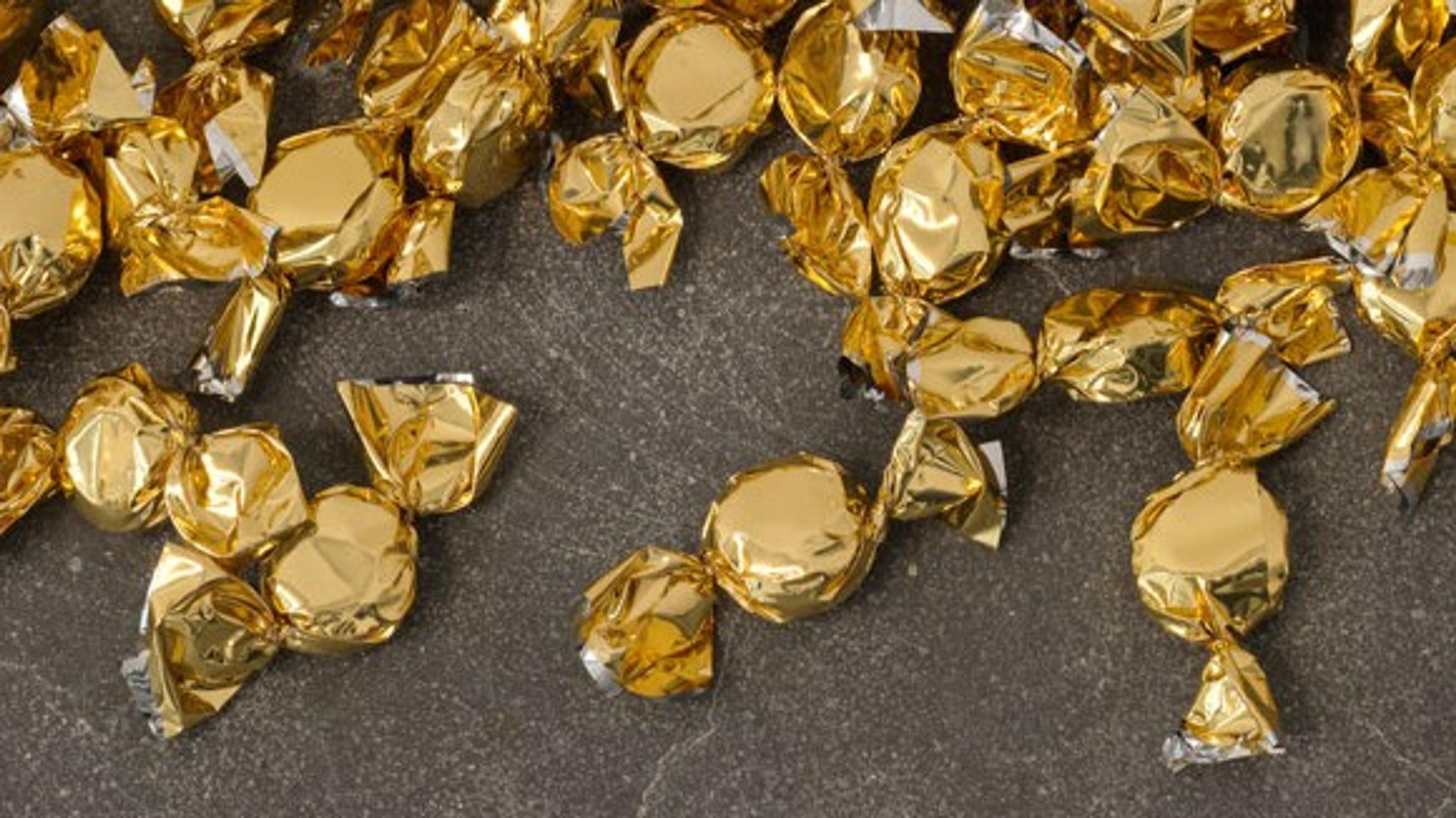 Foil wrapped candy in a gradient pattern on the ground