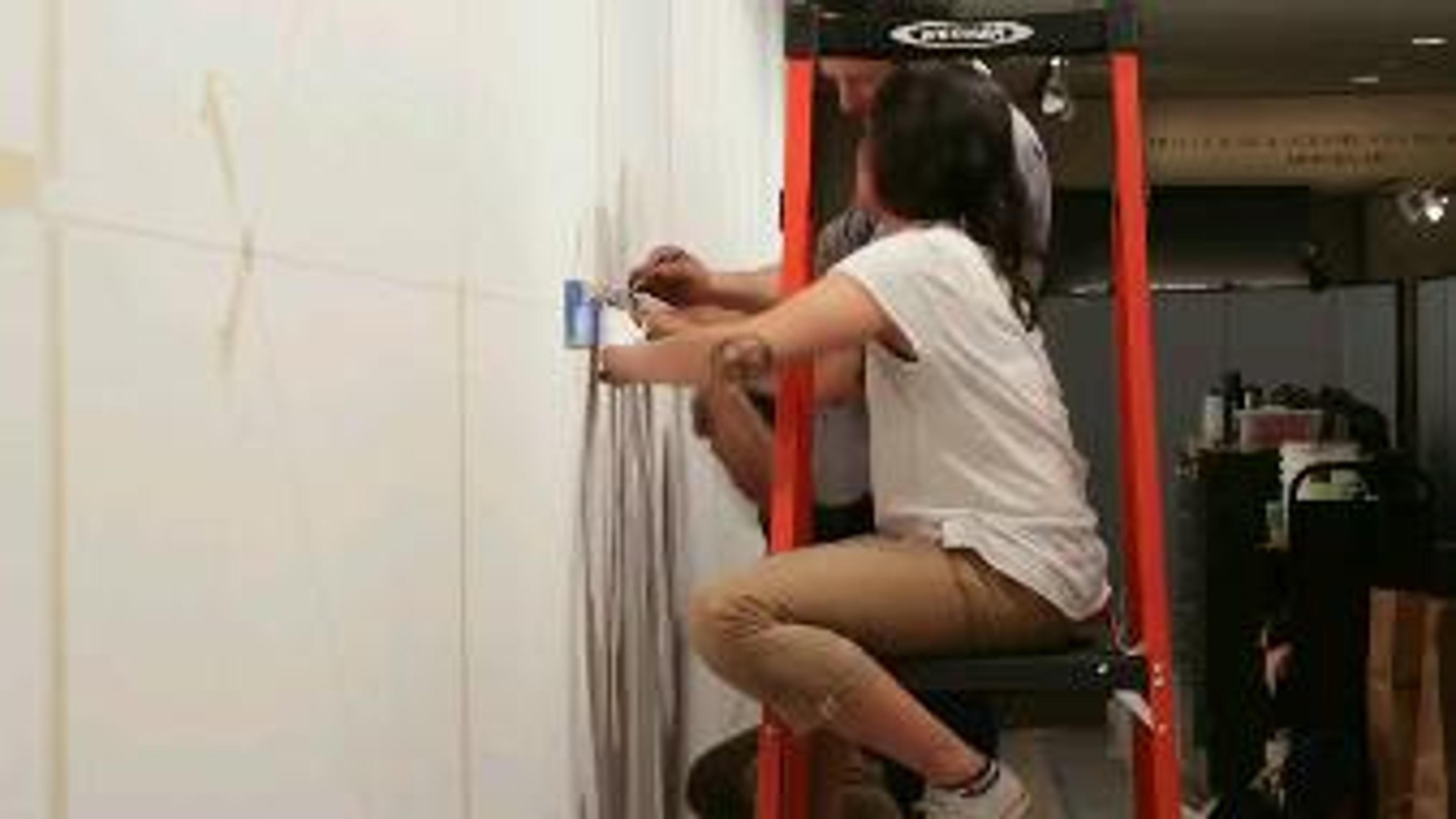 People installing Sol LeWitt's work in the gallery