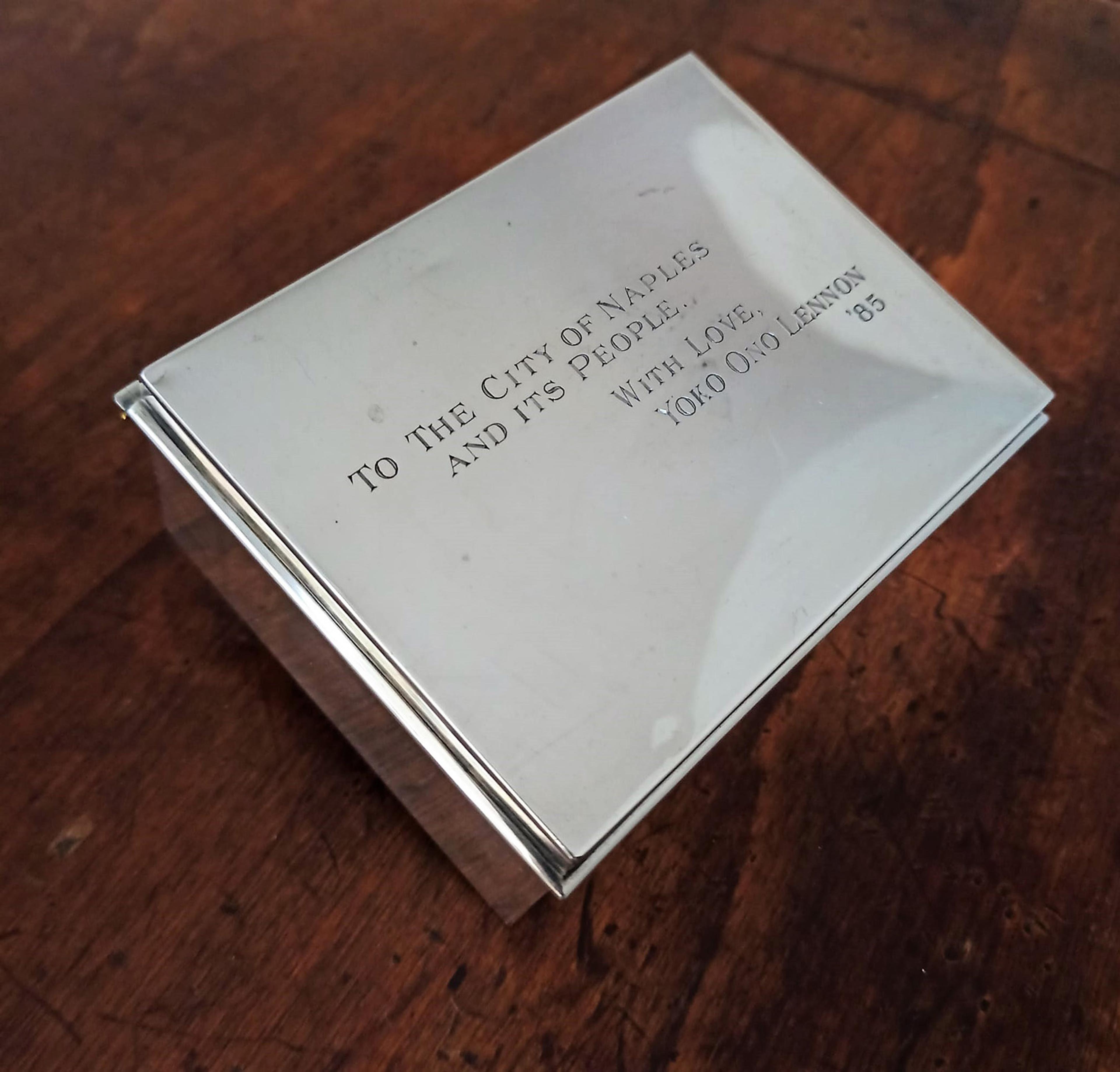 Image of silver box with black writing