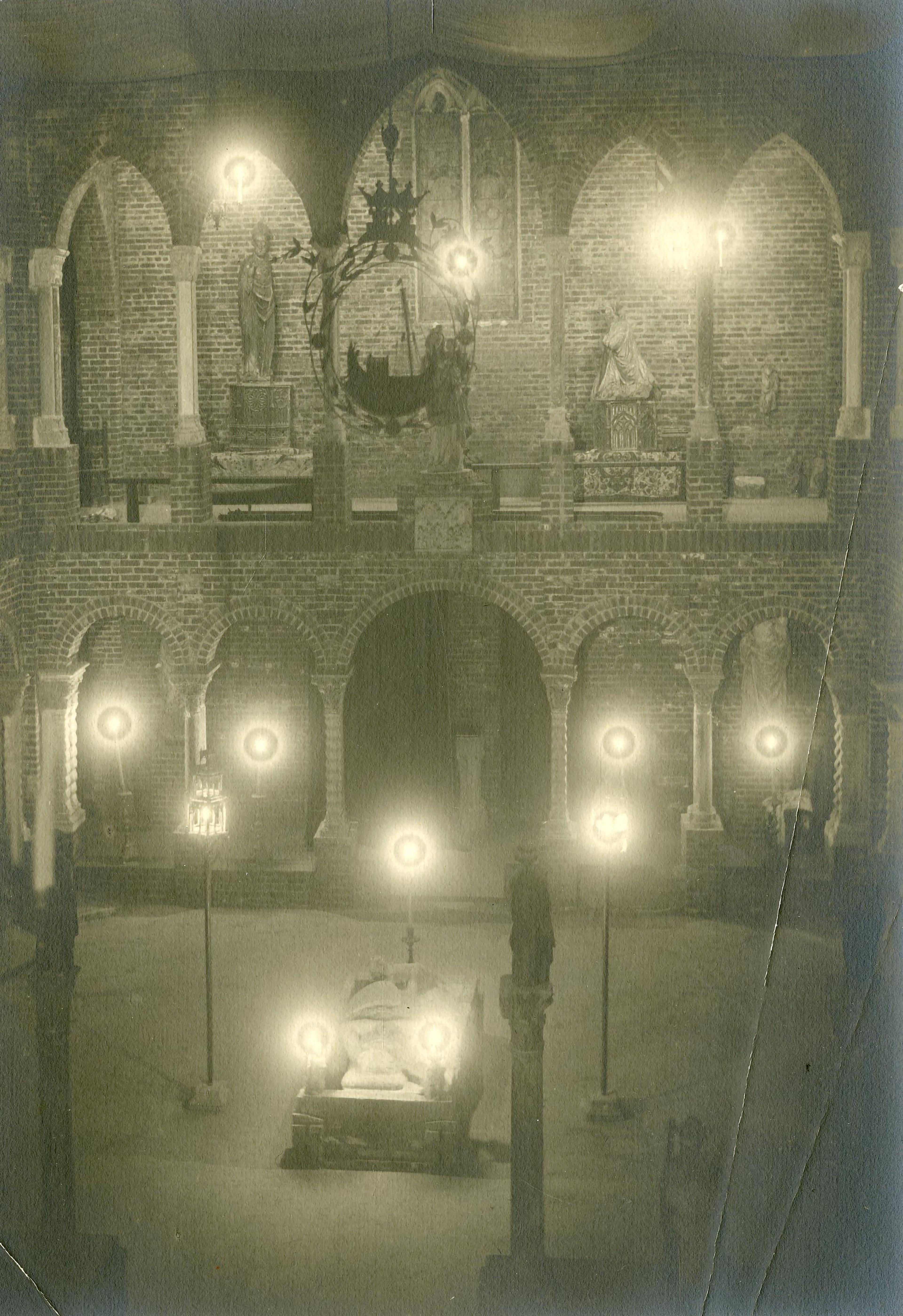 Shadowed, two-story archways illuminated by several orbs of light.