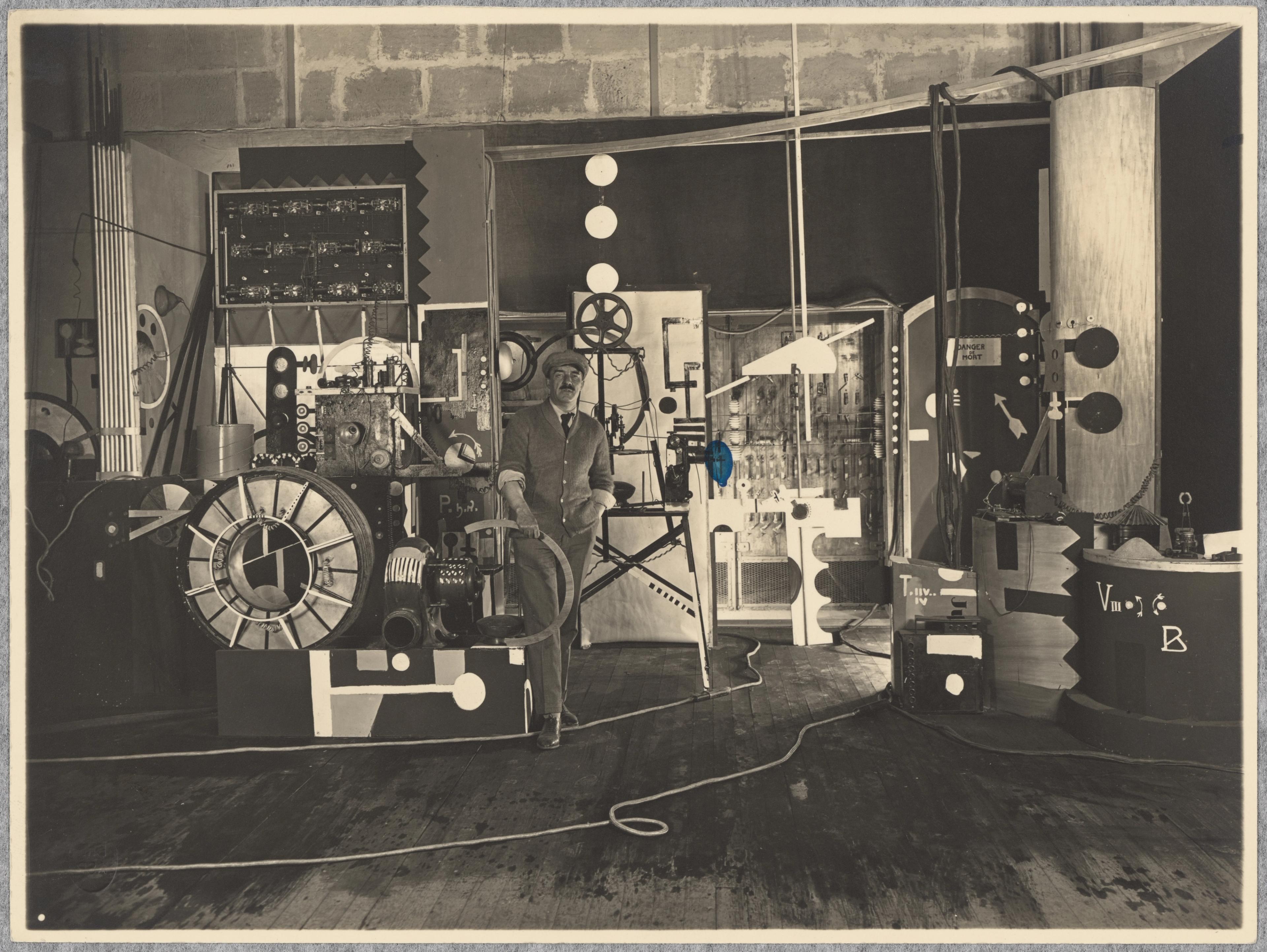 Image of production photograph from L'Inhumaine, 1922, directed by Marcel L'Herbier, showing Fernand Léger in the set he designed.